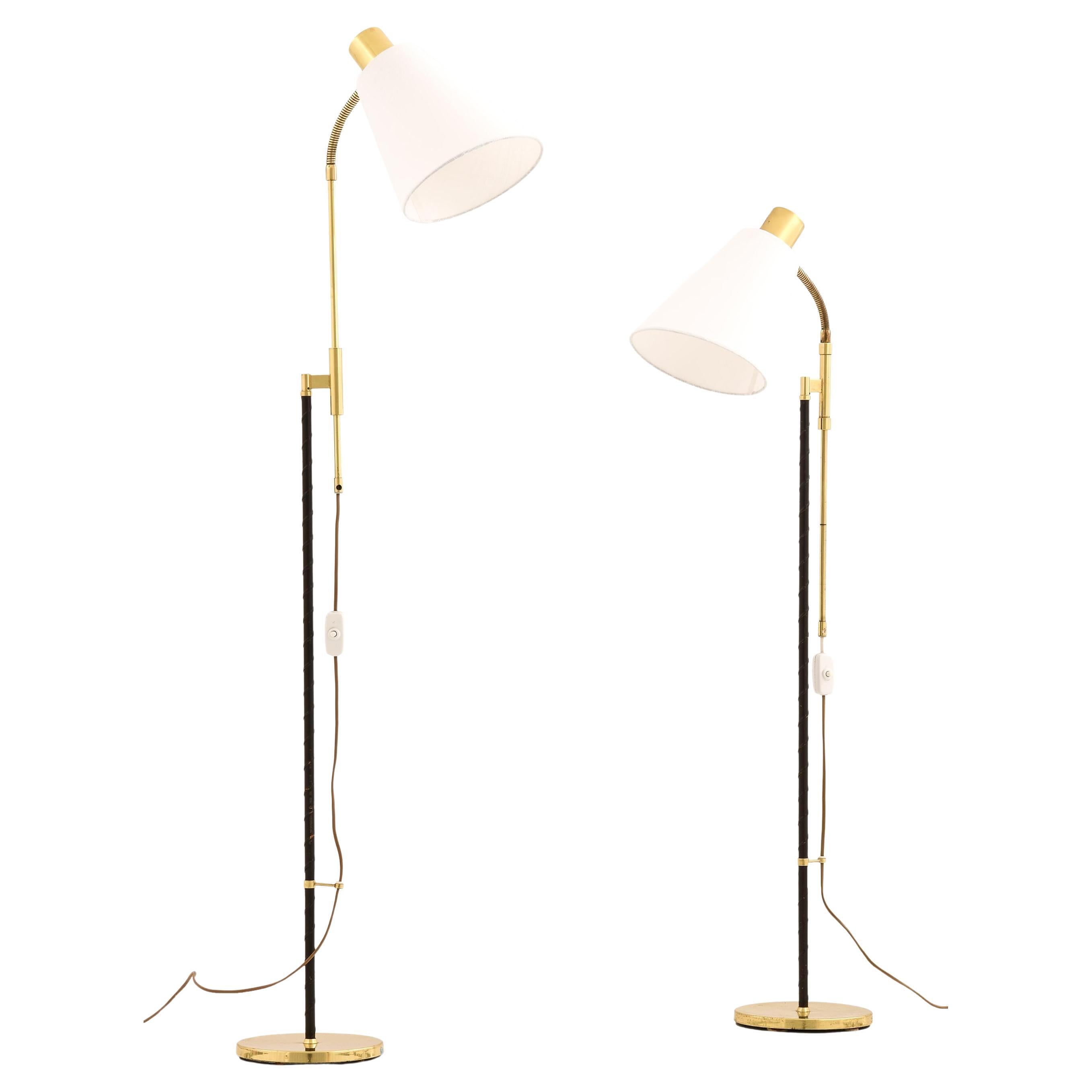 Coppia di lampade da terra regolabili in altezza, anni 
60 in vendita