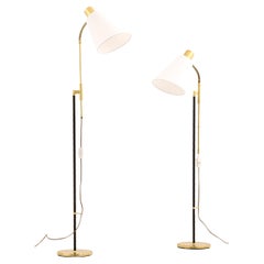 Coppia di lampade da terra regolabili in altezza, anni 
60