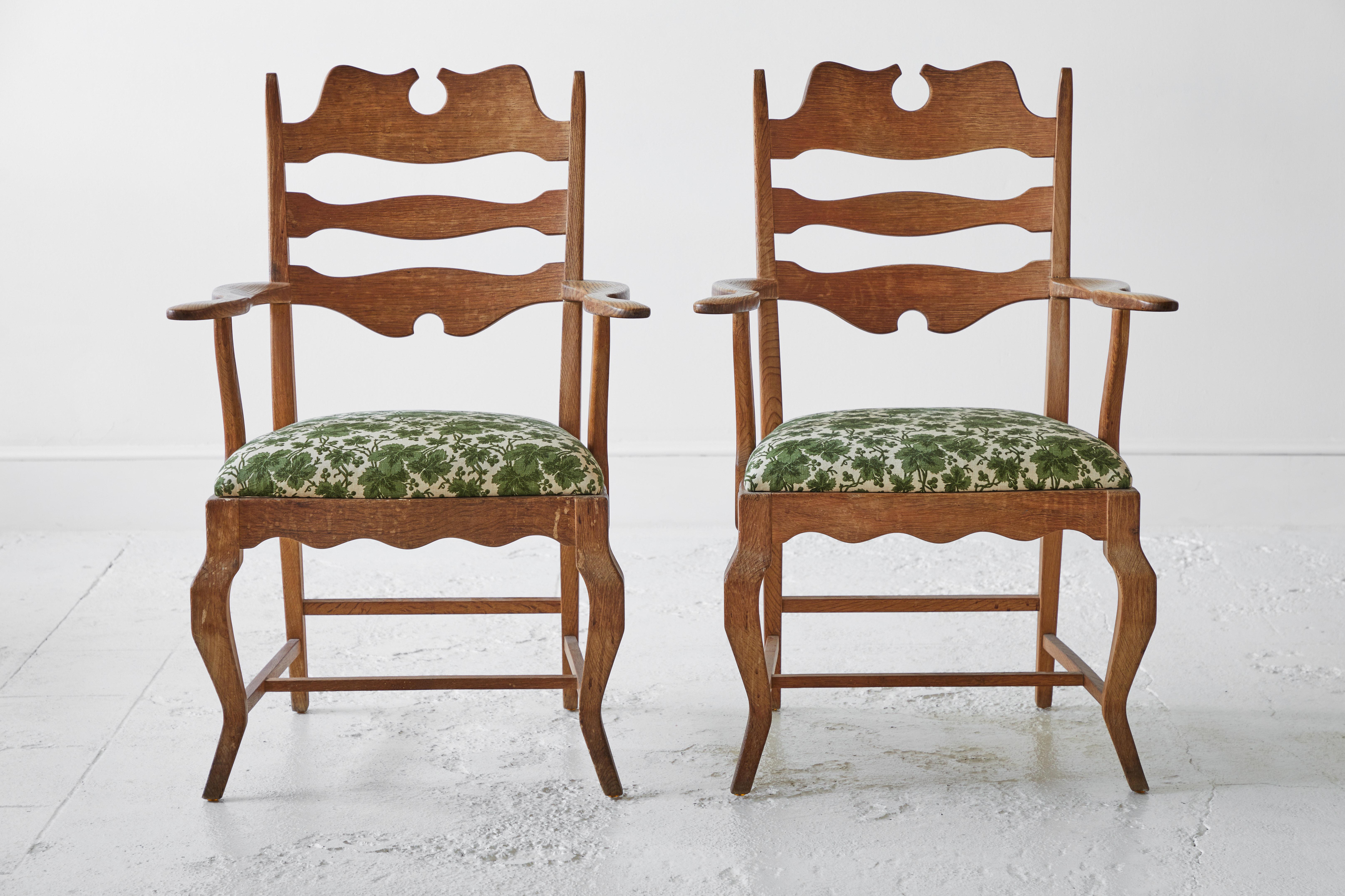 Stunning pair of armchairs by Henning Kjærnulf for Nyrup Moebelfabrik, Denmark, 1960s. The iconic “razor blade” shaped back rest give these chairs an unusual but striking appearance. The chairs provide a surprisingly comfortable seat due to its