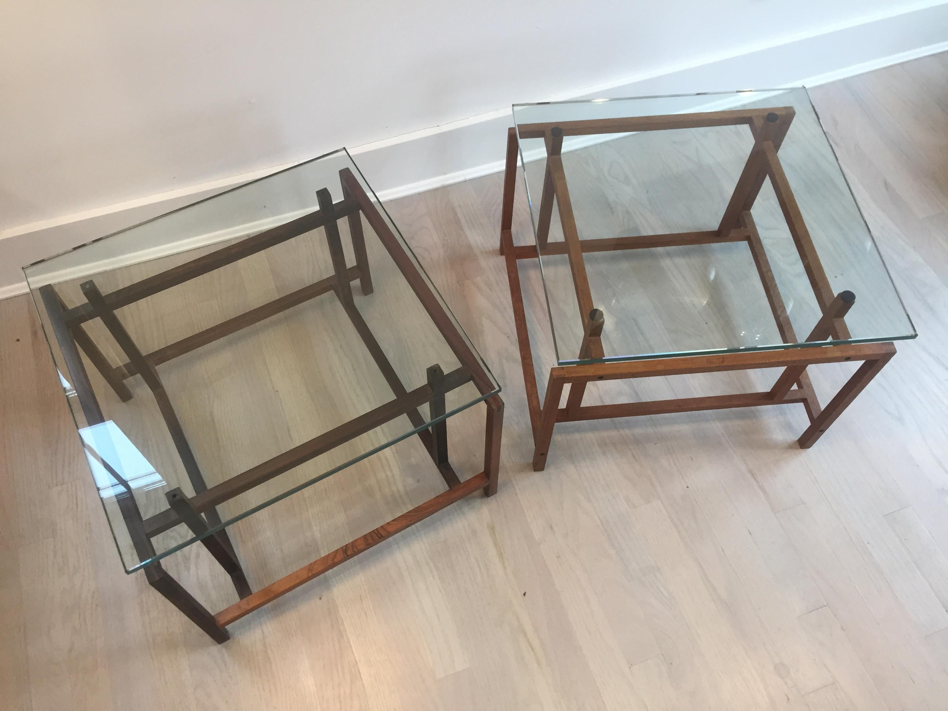 Pair of Henning Norgaard 1960s Danish modern side tables for Komfort

One of the tables is certainly rosewood while the other is slightly lighter in color and may be teak. They are both topped by 1/4” green hued glass.

Measure: 19.5” square and