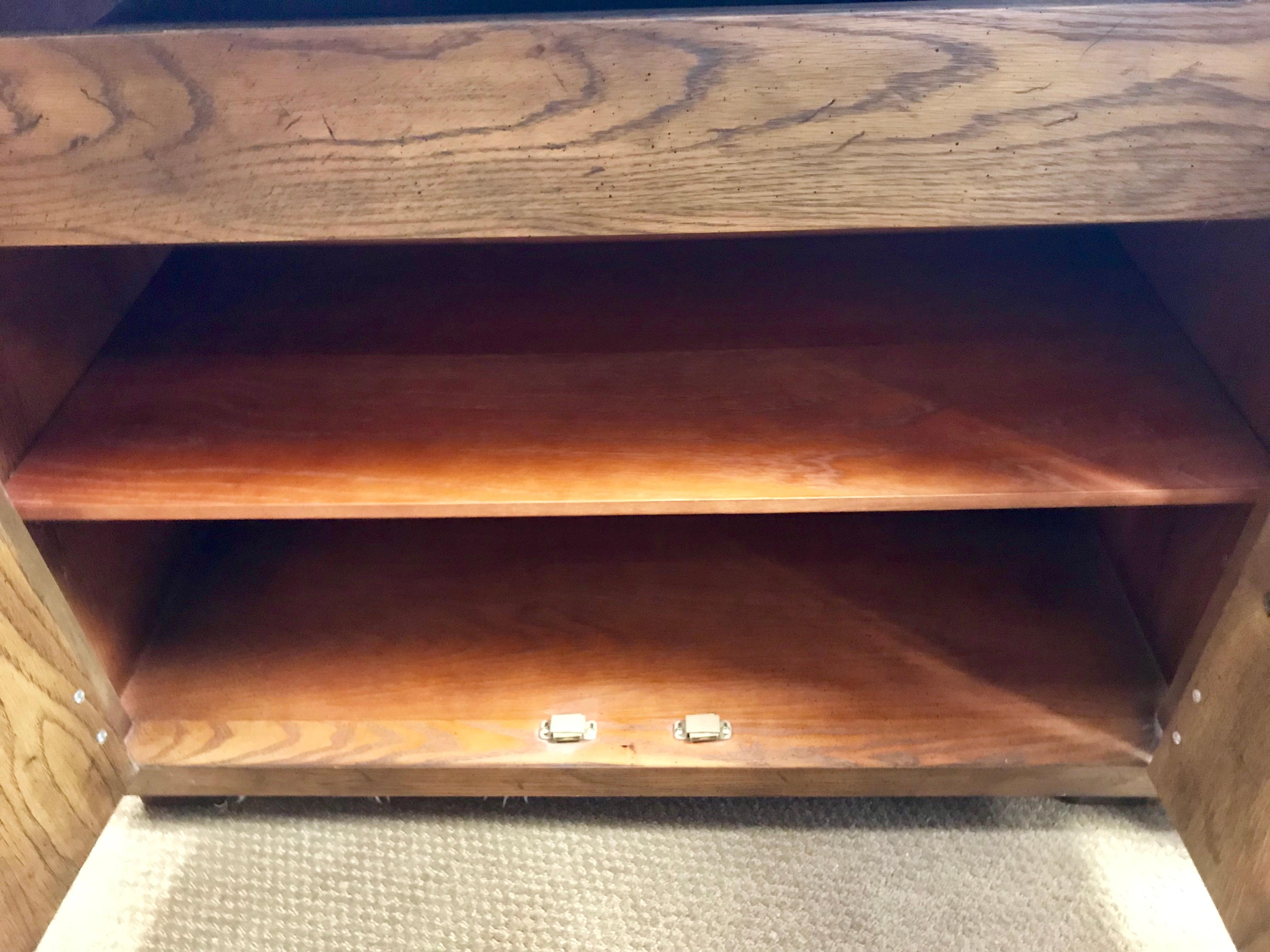 An exceptional pair of Henredon Campaign chests, circa 1970s. Handsome solid brass hardware adds accent. Exceptional craftsmanship and detail. Great as end tables or nightstands. When placed side by side, the pair will form a large credenza. Brass