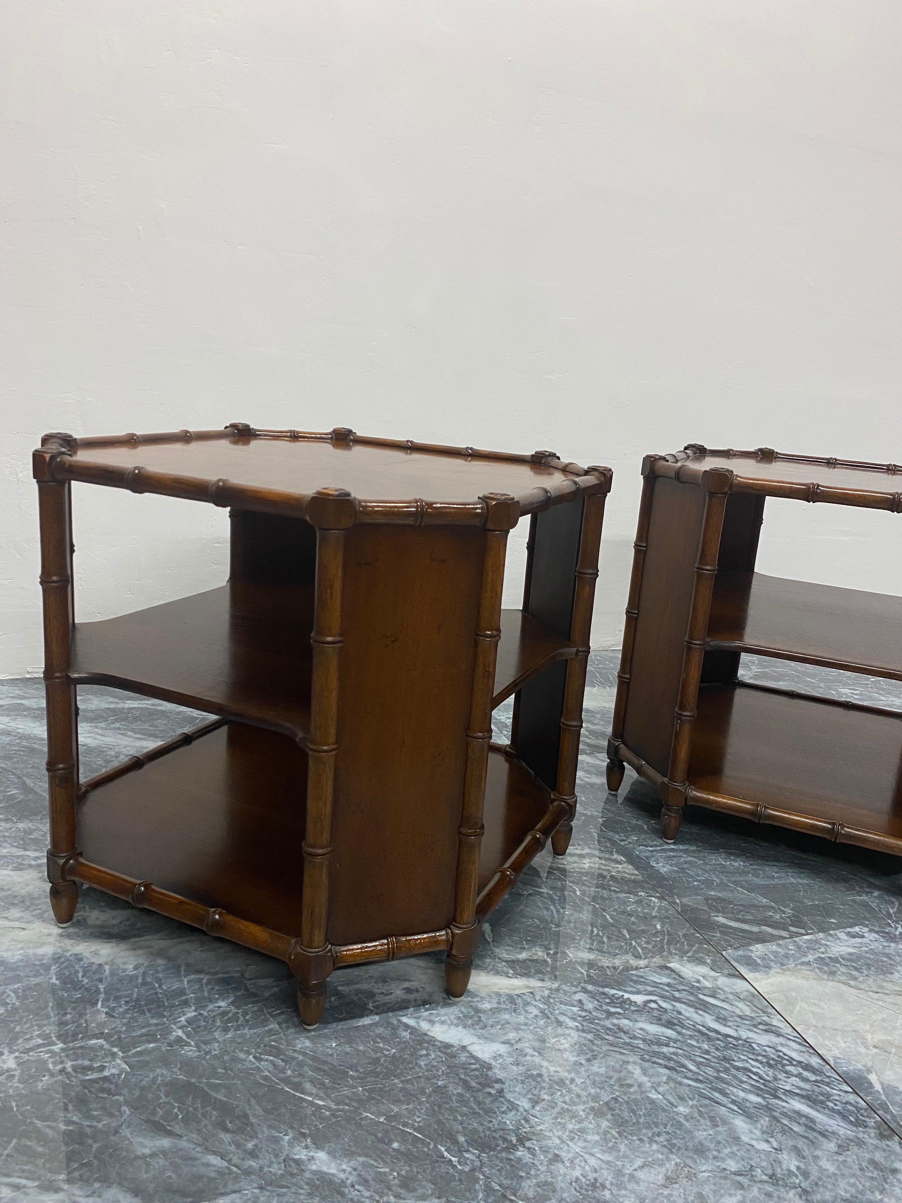 Pair of Mid-Century faux bamboo and stained wood side tables with two shelves by Henredon, 1970s.