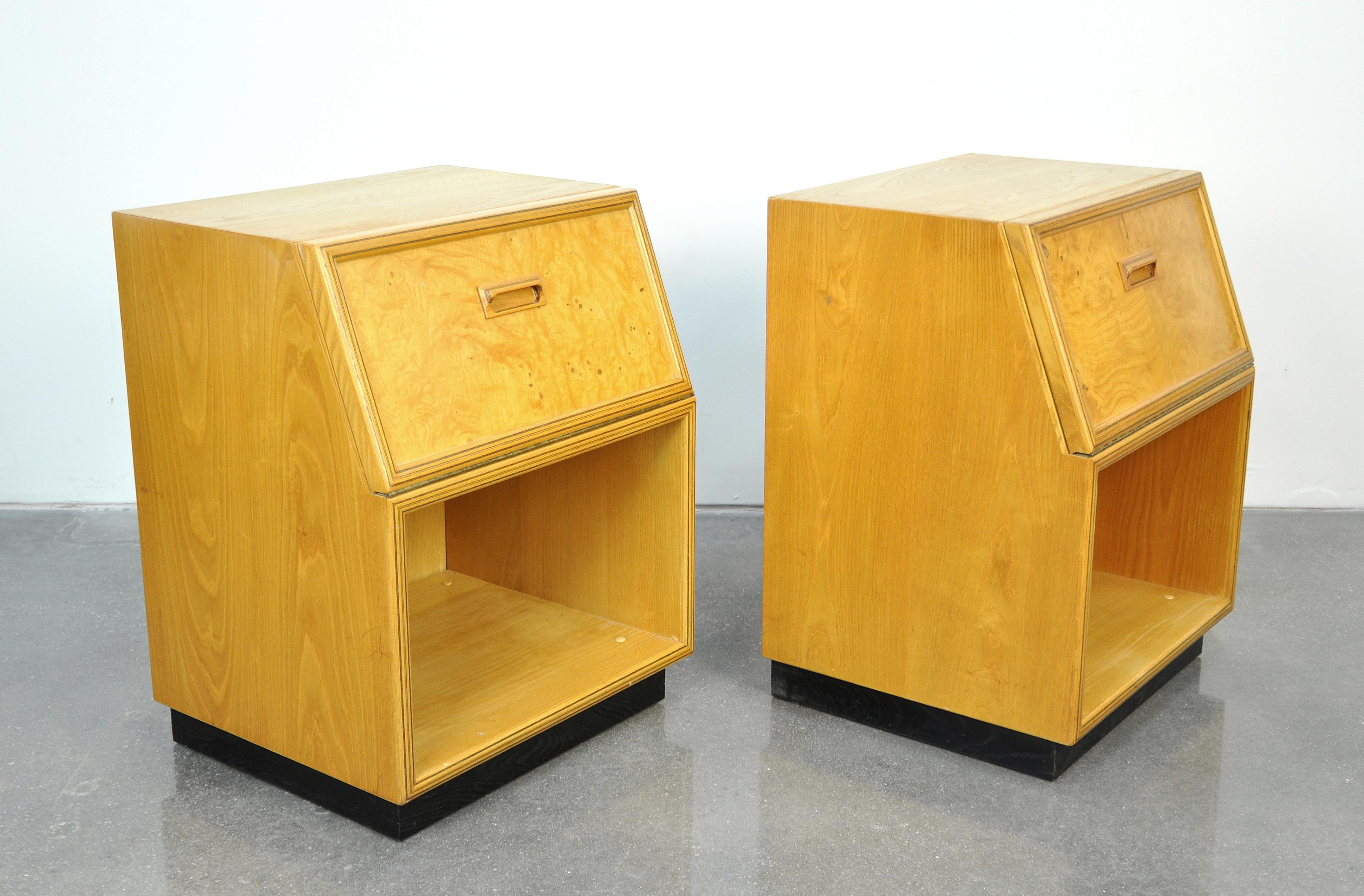 Pair of vintage Mid-Century Modern olivewood burl side or end tables from the desirable scene 2 collection manufactured by Henredon in the 1970s and 1980s. The bedside or occasional tables feature a fall front cabinet door with sculpted handles and