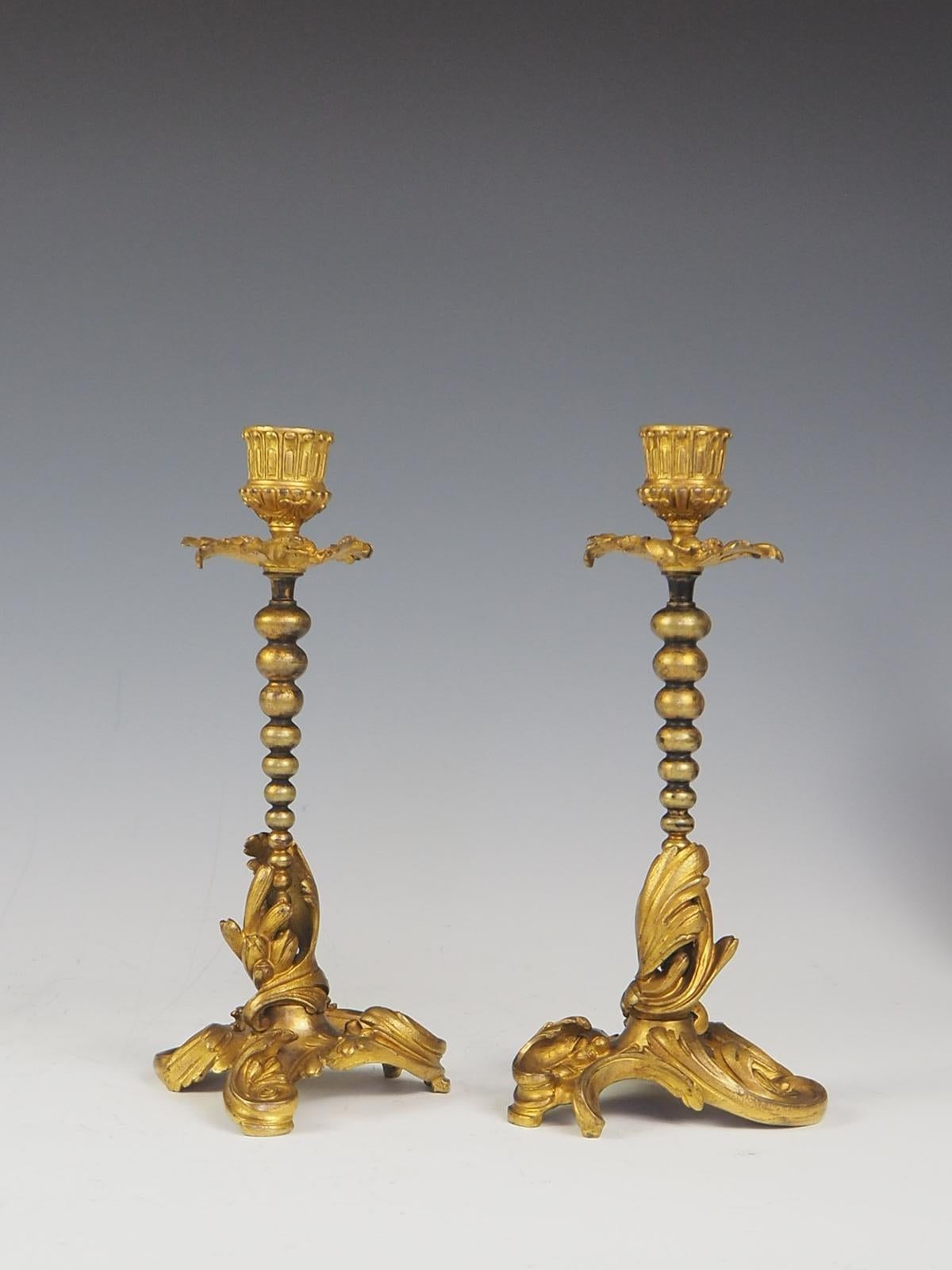 A pair of Henri Picard gilt bronze candlesticks circa 1850 Stamped. H. PICARD.

Napoleon III Ormolu Gilt Bronze candlesticks with beautiful detailing, acanthus leaves wrapping the base of the shaft and fine beads leading up to the acanthus leaf