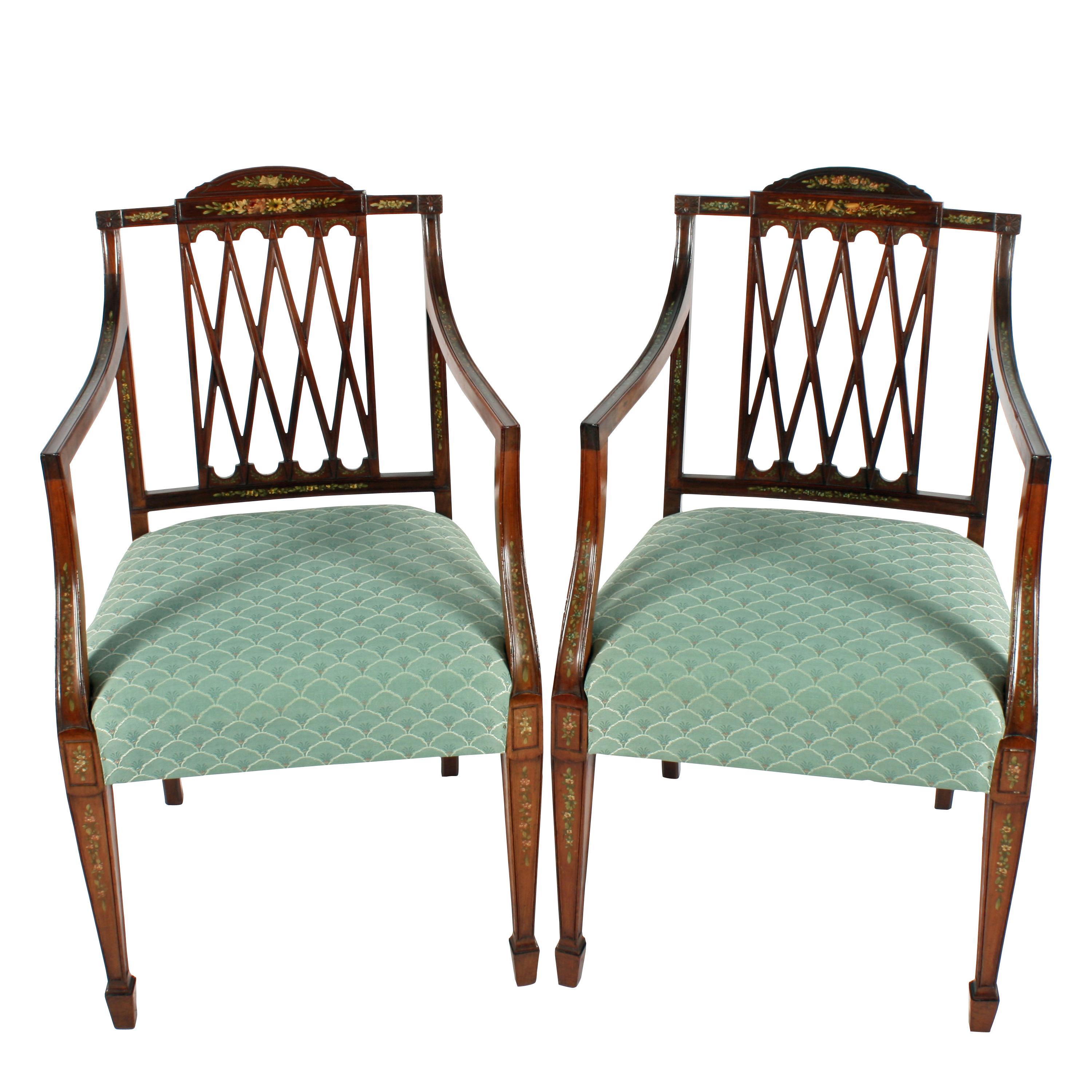 A fine pair of late 19th century Hepplewhite style mahogany elbow chairs.

The chairs have quadruped 'X' backs with a centre domed top rail and straight arm which have an integral concave support.

The front legs are square and tapering and have