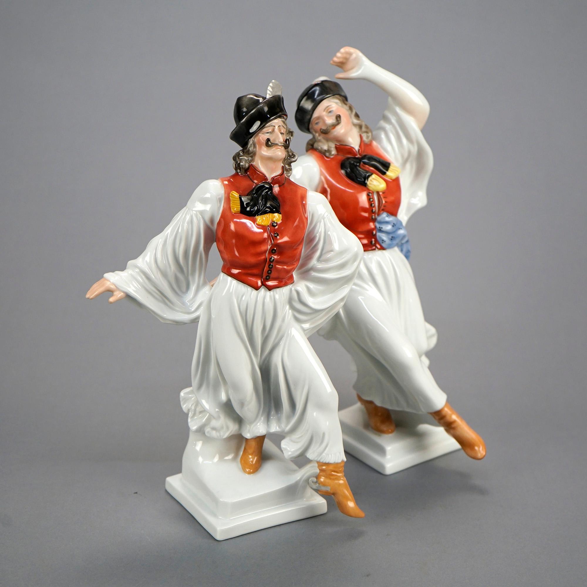 A pair of Herend porcelain figures depict Hungarian folk dancers, maker mark on base as photographed, 20th century

Measures - 12'' H x 8'' W x 5.5'' D; 11.25'' H x 7.5'' W x 5'' D.