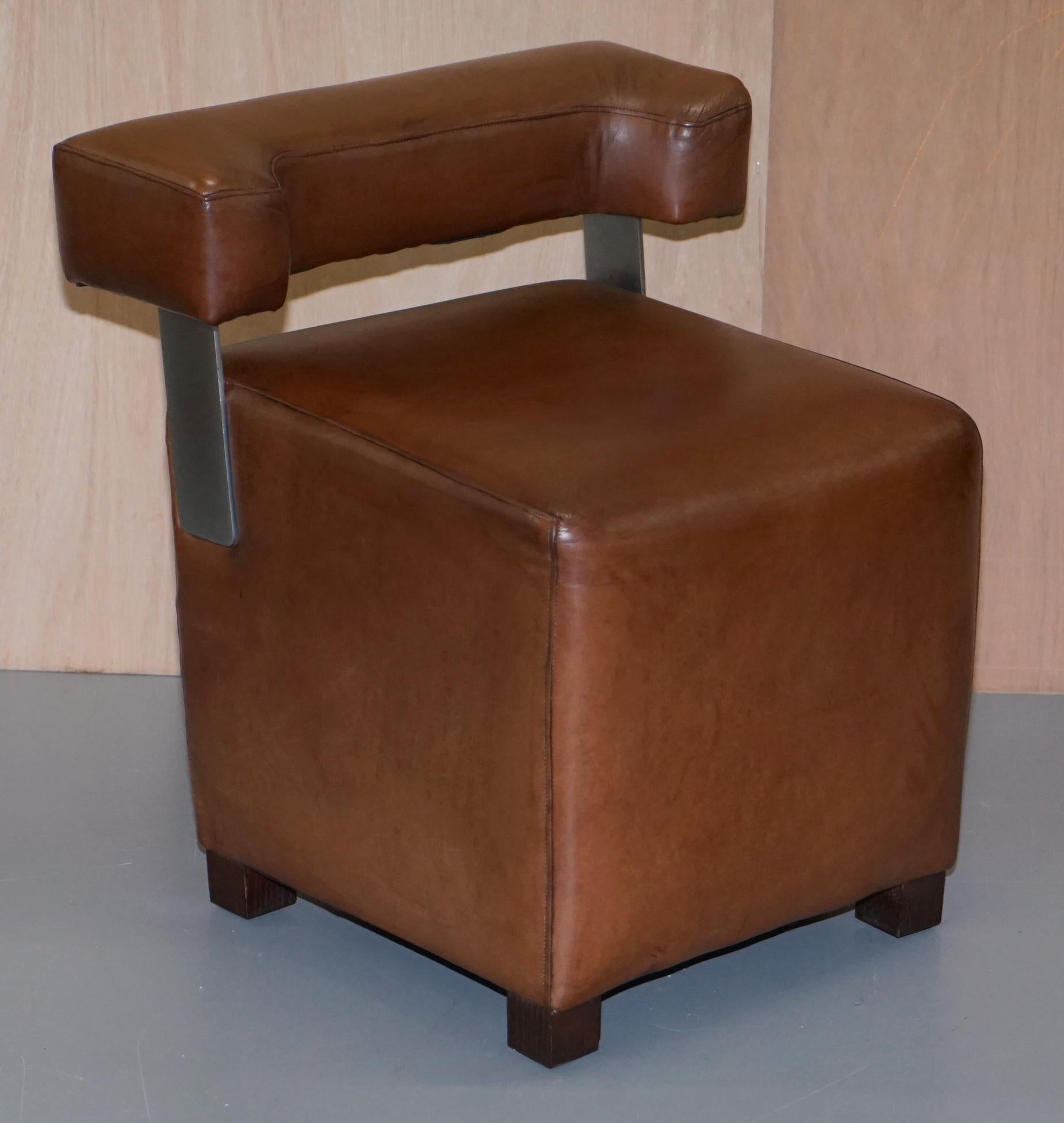 We are delighted to offer for sale this lovely pair of small heritage brown leather stool armchairs with chrome supports

A good looking and decorative pair of contemporary small armchairs, they are very utilitarian and great for when you have