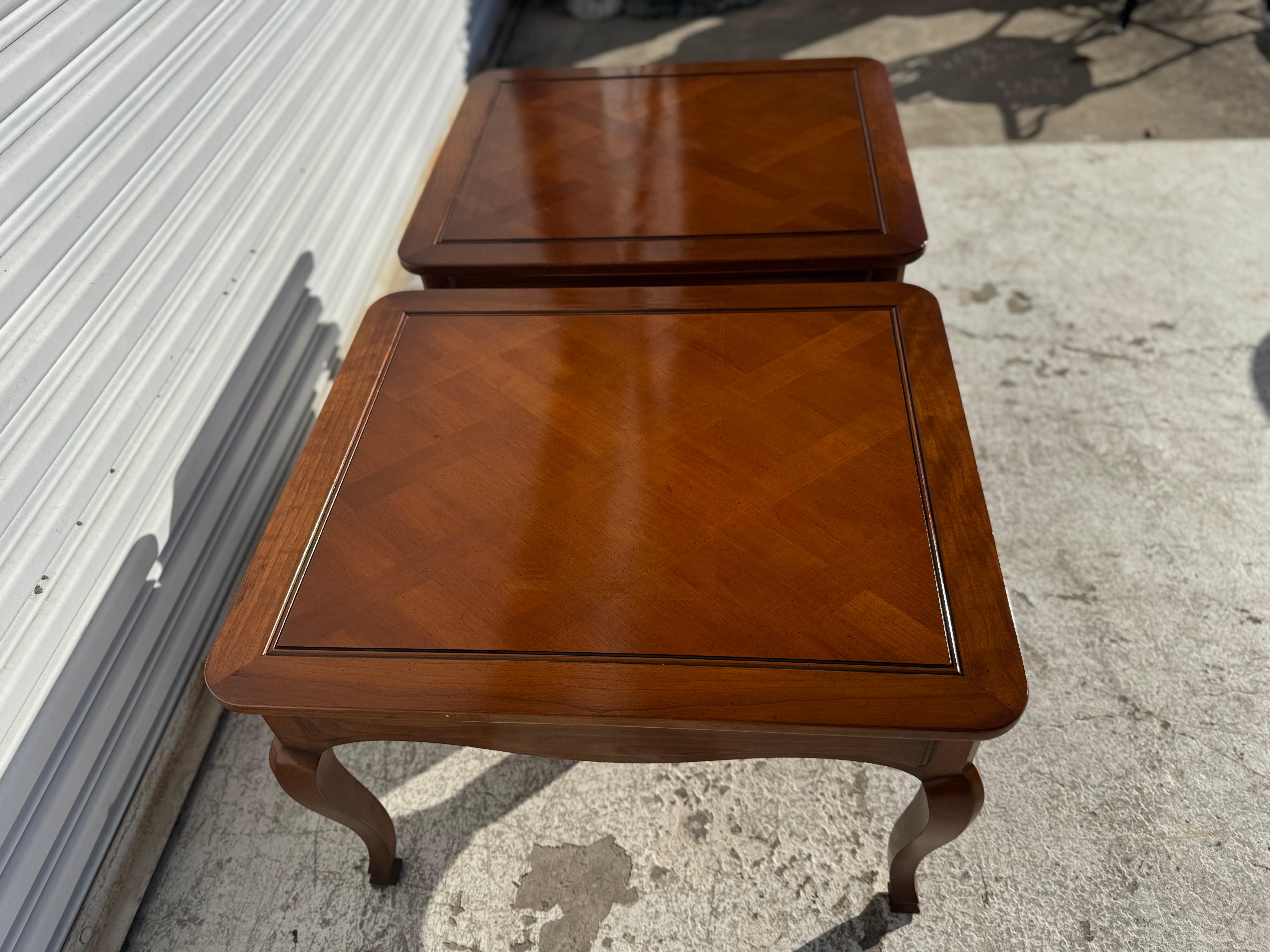 These tables are constructed from solid walnut.
The tops are done in a parquet top manner.
They have cabriole style legs that terminate in to
bun feet.
