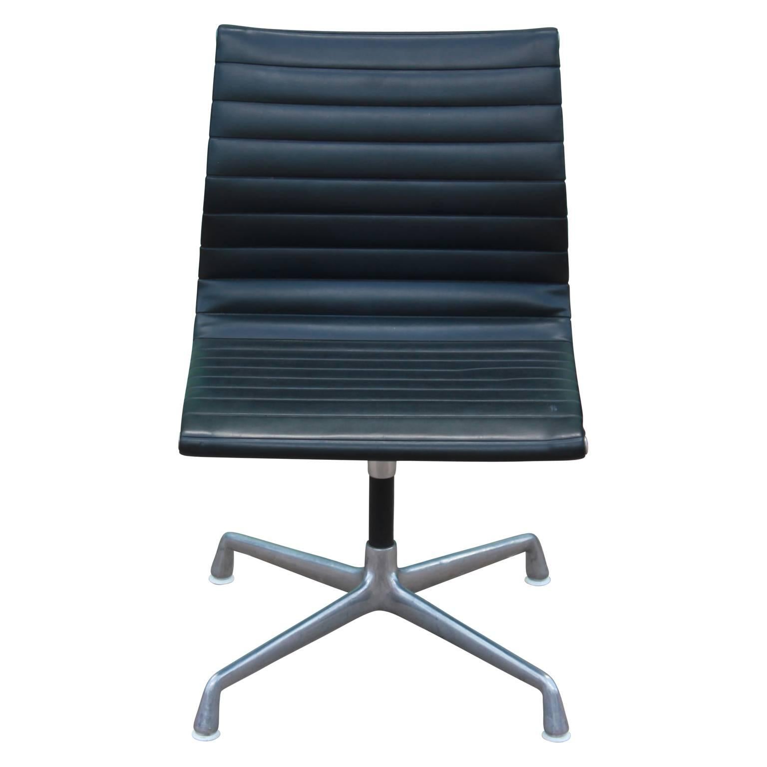 Pair of Charles Eames for Herman Miller aluminum group armless office chairs. Made in the mid-1960s with aluminum and Naugahyde and are wonderful for an office or desk.