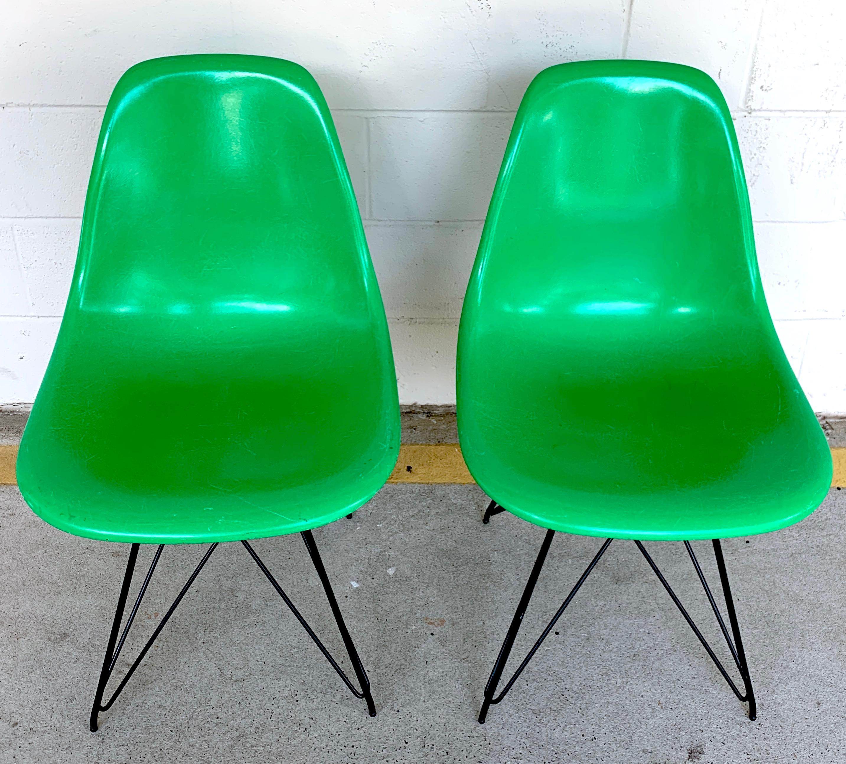Pair of Herman Miller Eames Eiffel Tower green shell chairs, a great pair in good vintage condition, in a discontinued color. 
Herman Miller chairs 31 H x18.5 W x 16 D, 17.5 SH
18.5