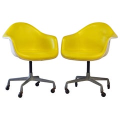 Pair of Herman Miller Upholstered Shell Swivel Chairs by Charles and Ray Eames