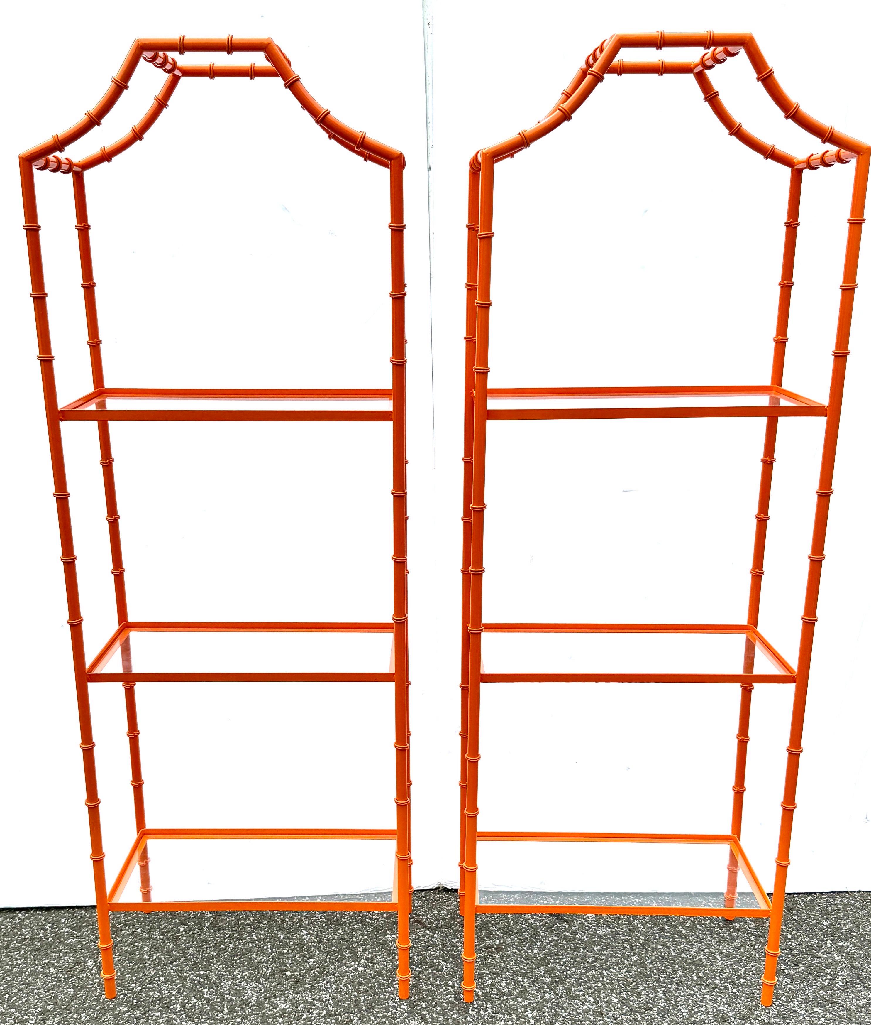 Mid-Century Modern Orange Faux Bamboo Etagere Shelves, A Pair

Two metal faux bamboo etageres in a powder-coated color we like to call Hermes Orange finish. These mid-century etageres feature three glass shelves perfect for displaying your favorite