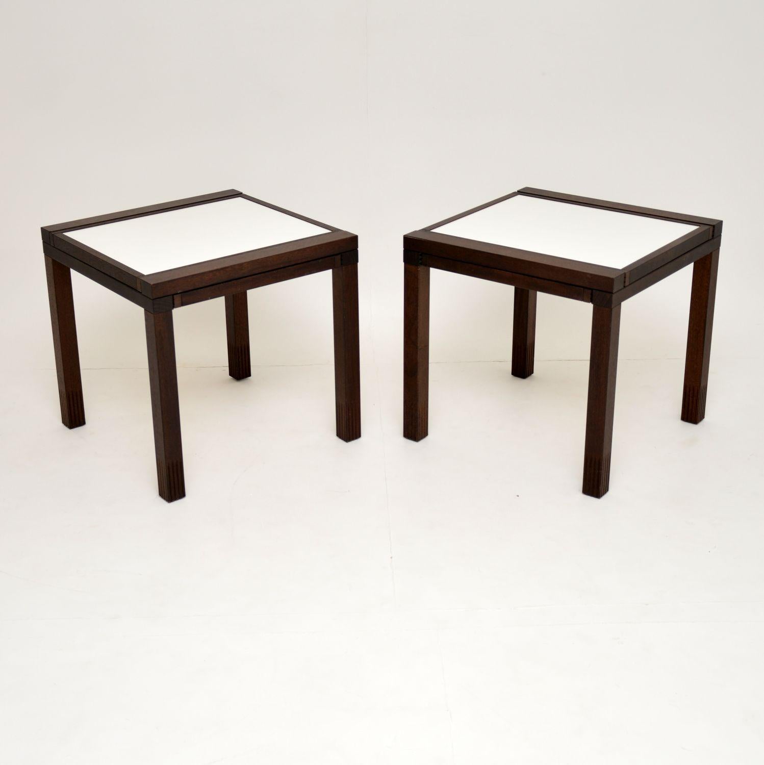 A stunning and very rare pair of vintage ‘Hexa’ side tables, these were designed by Bernard Vuarnesson. They were made in Italy during the 1980s by Bellato. These are made from solid wood, each has two separate white Formica tops that slide out at