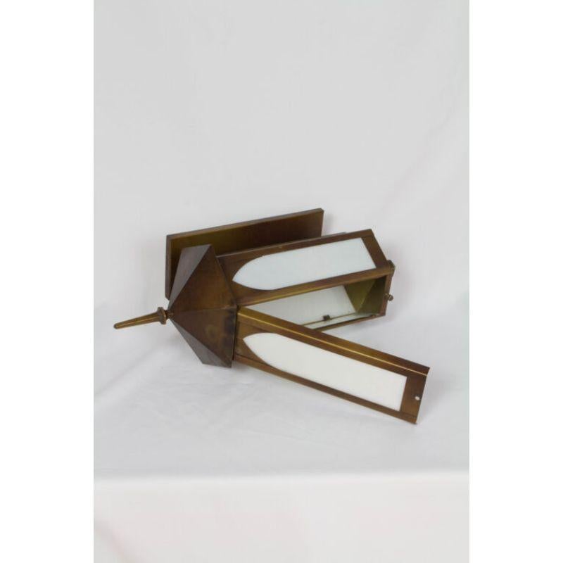 Pair of Hexagonal Exterior Sconces. White glass and antique brass finished metal. Restored and rewired, ready to install. American, C. 1960.

Dimensions: 
Width: 9?
Height: 20?
Depth: 9?
Backplate Dimensions: 4.5? W x 11.5?H.