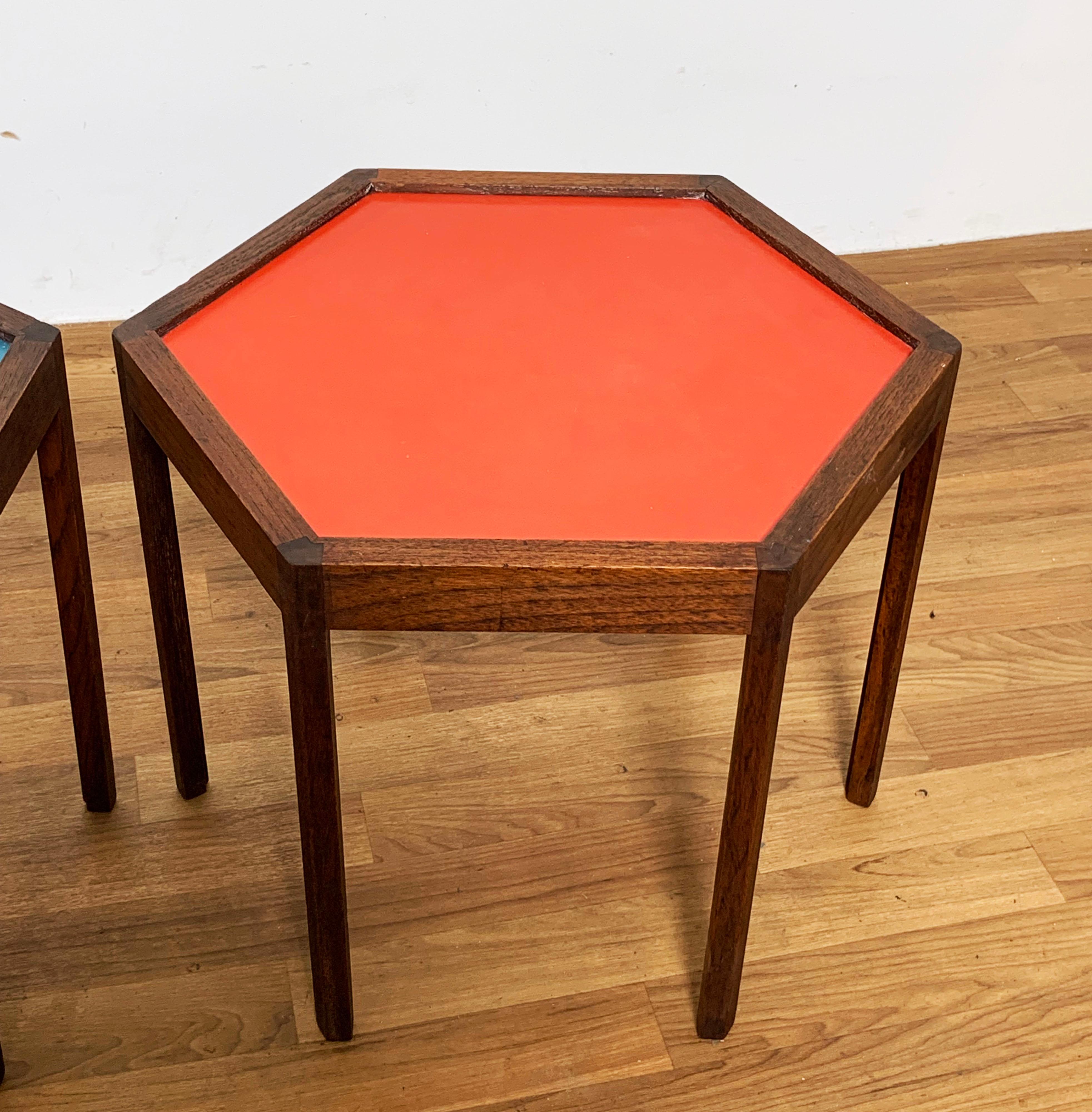 Pair of hexagonal Danish side tables in rosewood with colorful laminate tops, designed by Hans C. Andersen, circa 1960s.