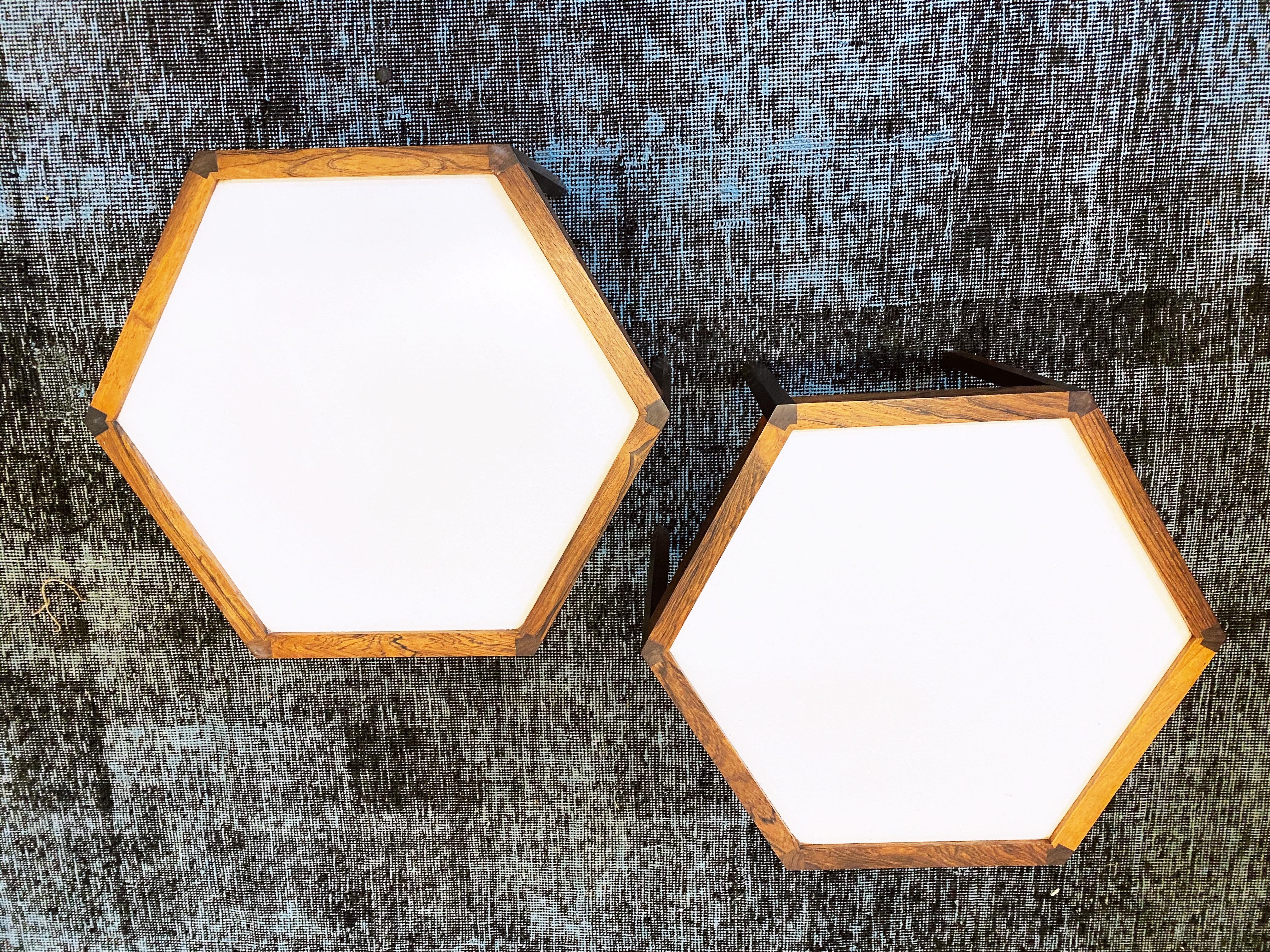 This pair of white top laminate and rosewood hexagonal side tables designed by Hans C. Andersen are in excellent condition.
circa 1960s. Denmark.
Dimensions: 19
