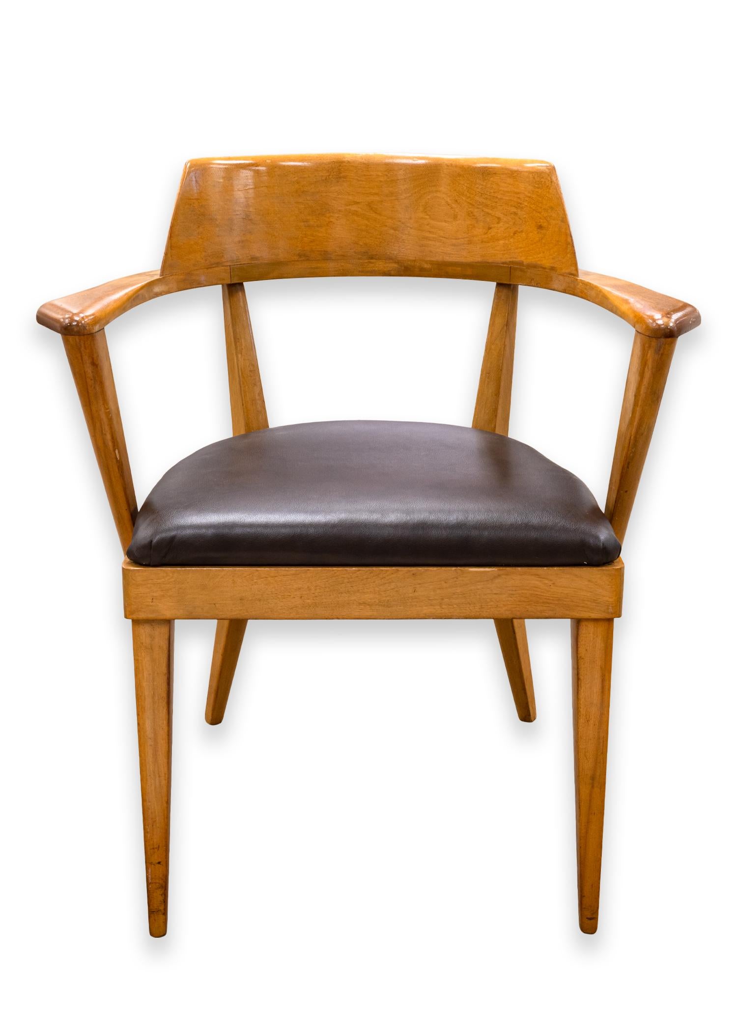 A pair of Heywood Wakefield arm chairs. A very handsome set of armchairs designed by Leo Jiranek and Ernest Herrmann for Heywood Wakefield. These chairs are constructed out of birch with a 
