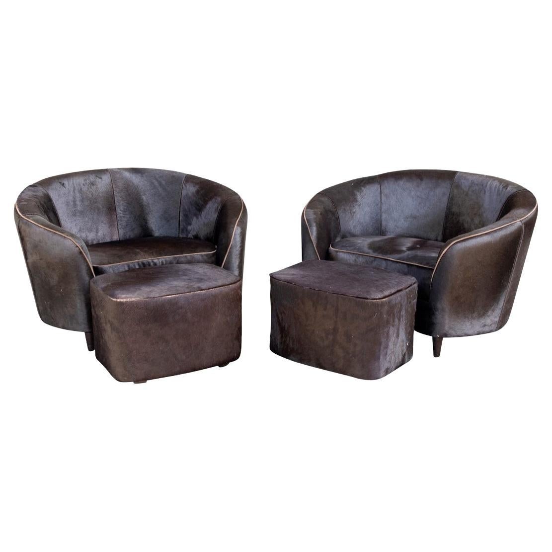 Pair of Hide Upholstered Club Chairs and Ottomans by Stone International