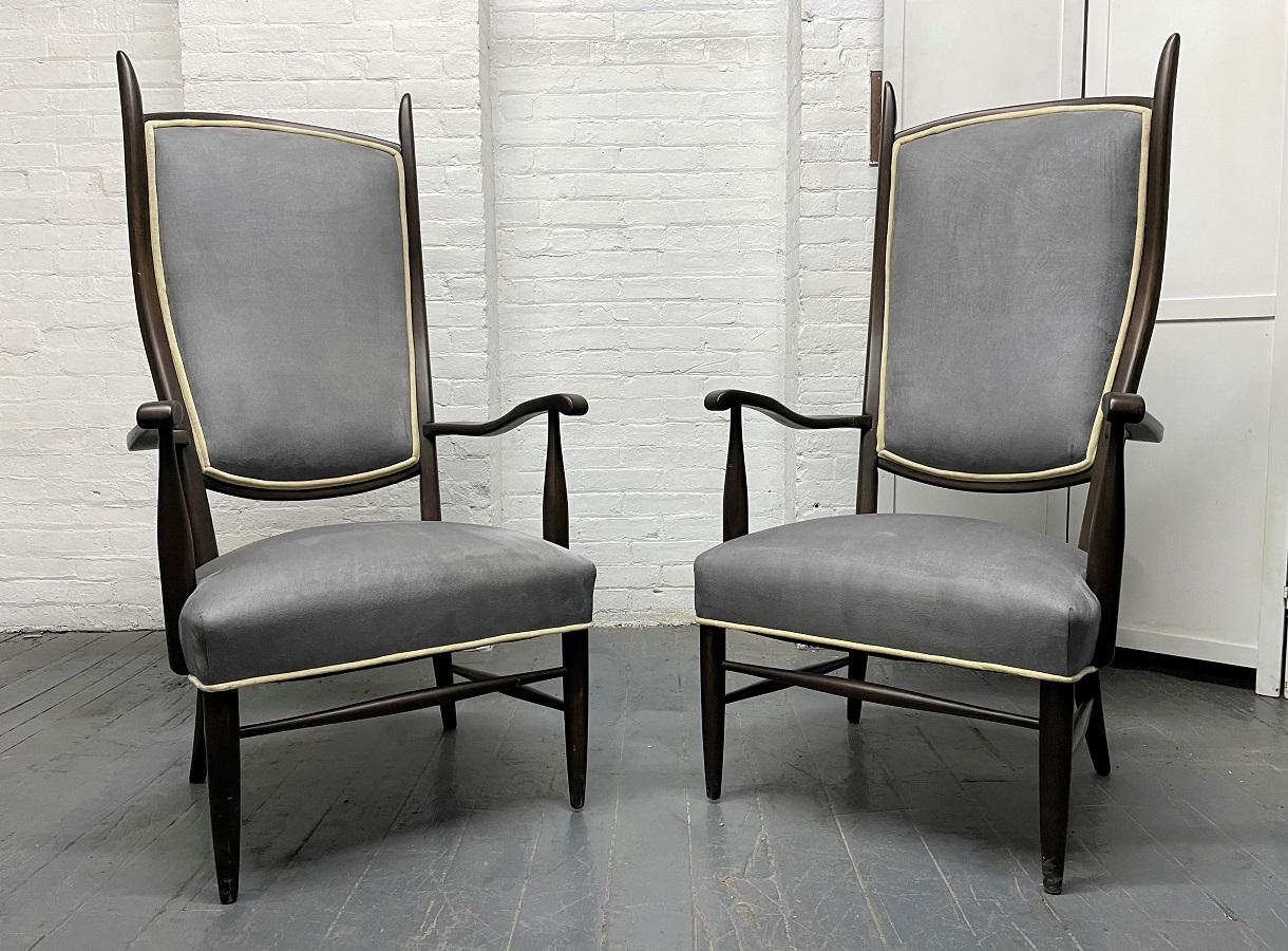 Pair of high back armchairs in suede upholstery. Has a slightly curved back with a lacquered frame.