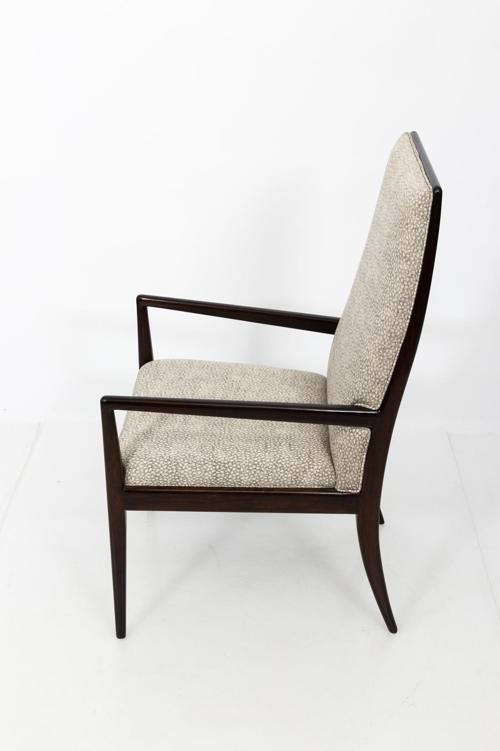 Pair of sculptural high back armchairs in the manner of T.H. Robsjohn-Gibbins, circa 1950s-1960s. Newly refinished in a deep espresso wood with cream and black upholstery.