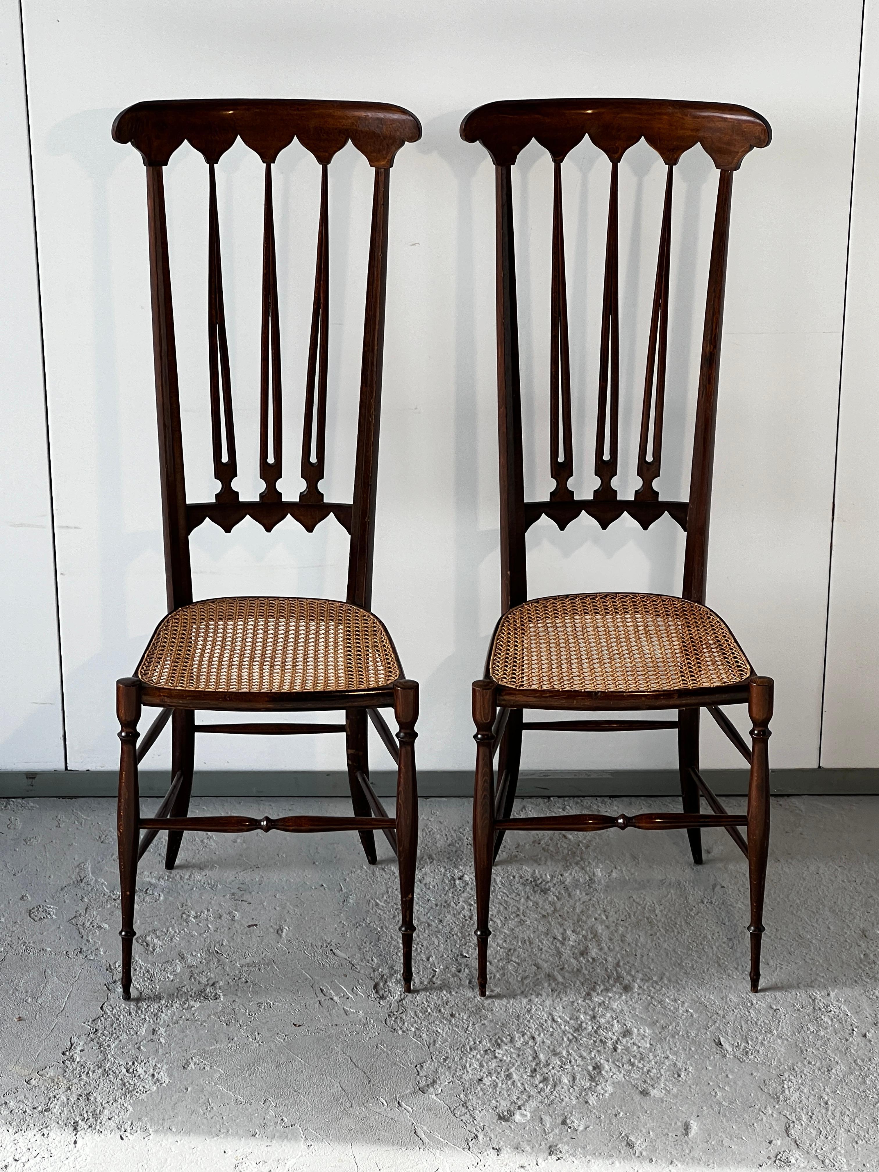 Pair of high back chairs attributed to Gio Ponti for Sac Italian design 1950 Manual cane seats redone to new Good condition of the structure Seat height 48 cm height : 118 cm Width : 41 cm Depth : 34 cm