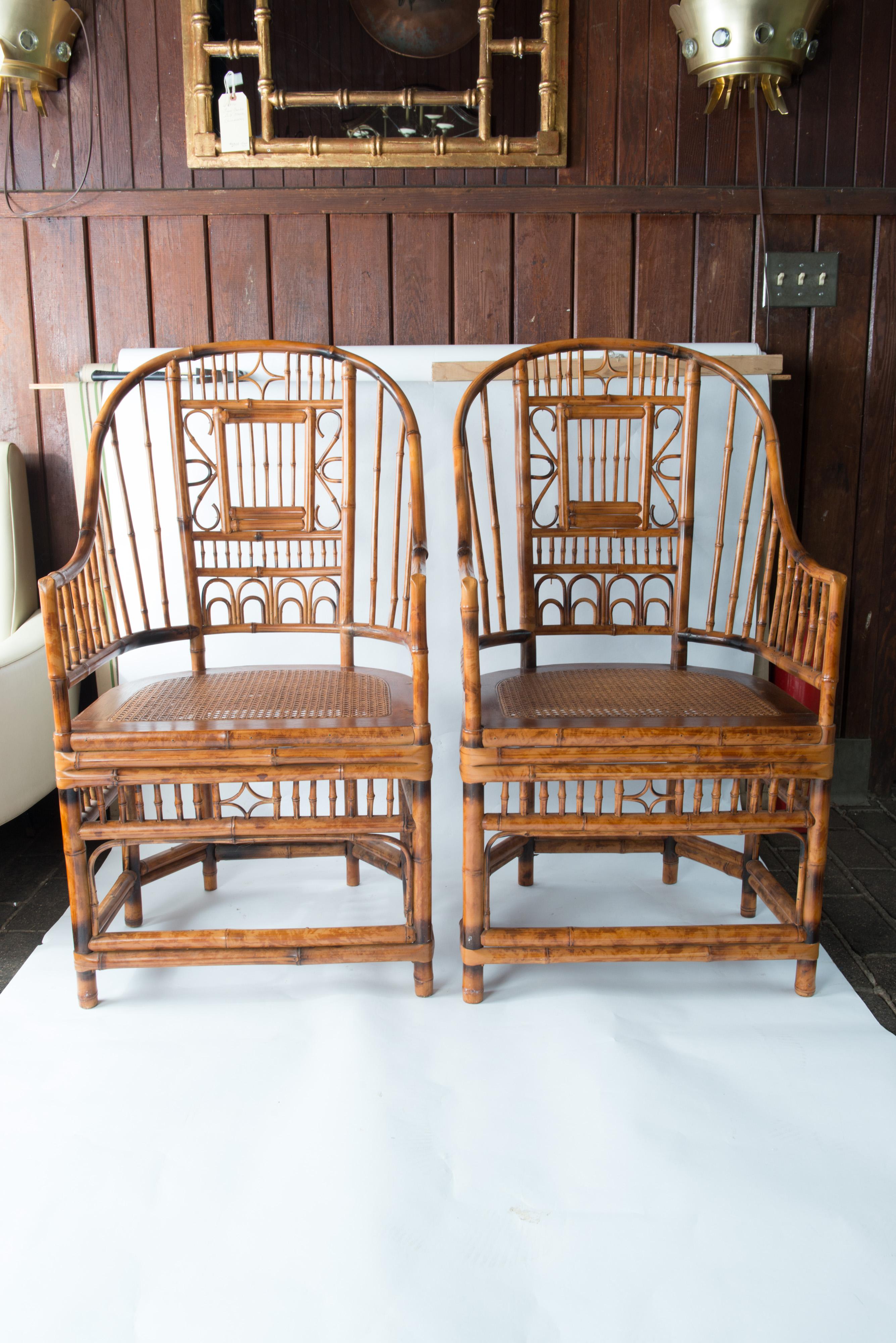 Brighton Pavilion style Chinese Chippendale bamboo and rattan armchairs with cane seats.