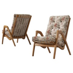 Pair of High Back Lounge Chairs with Sculptural Armrests in Oak Pair of High Back Lounge Chairs with Sculptural Armrests in Oak