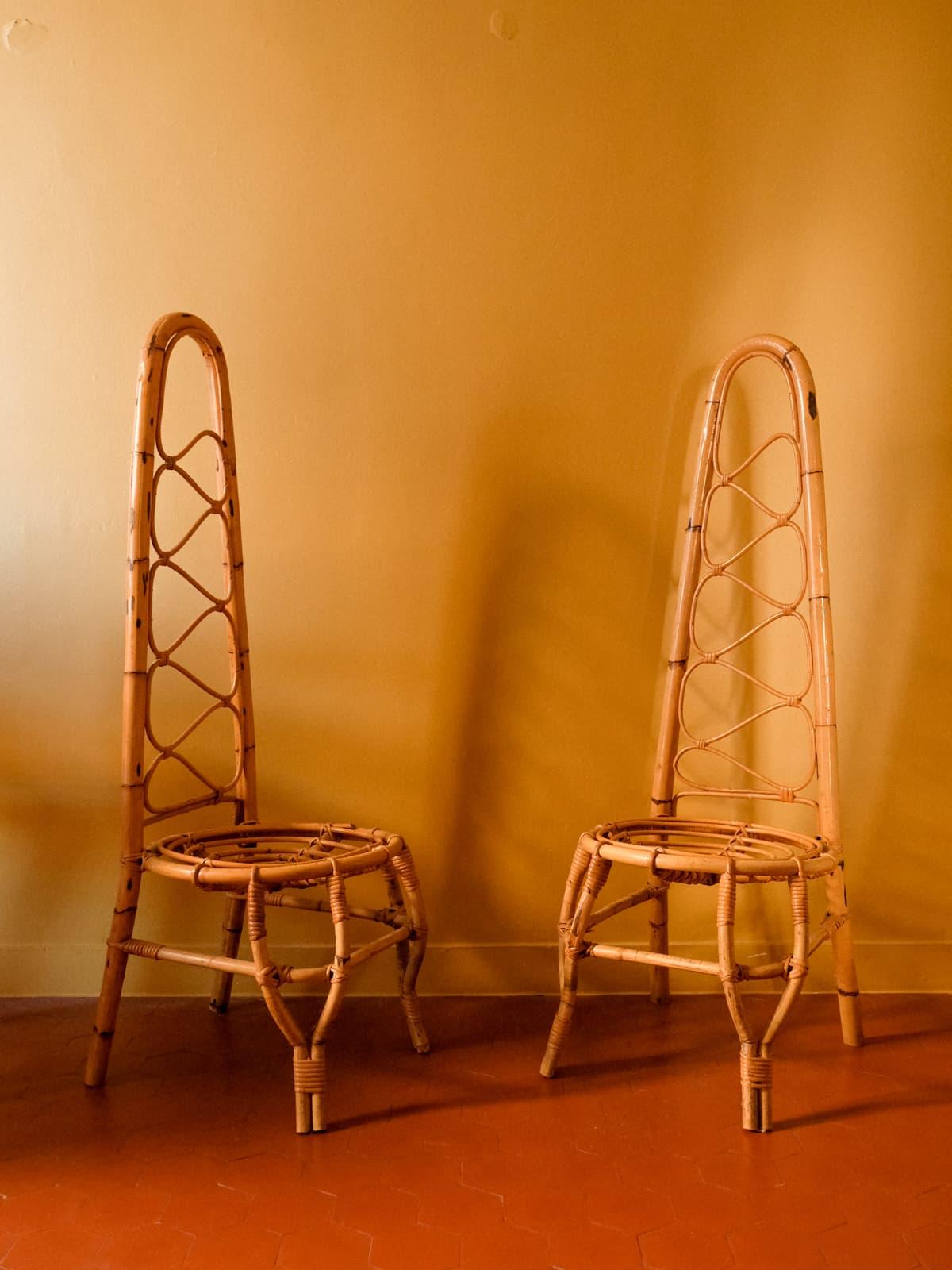 Pair of High Back Rattan Chairs in the style of Bonacina, Italy, circa