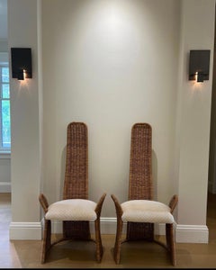 Pair of high back wicker accent chairs designed by Danny Ho Fong for Tropic-Cal