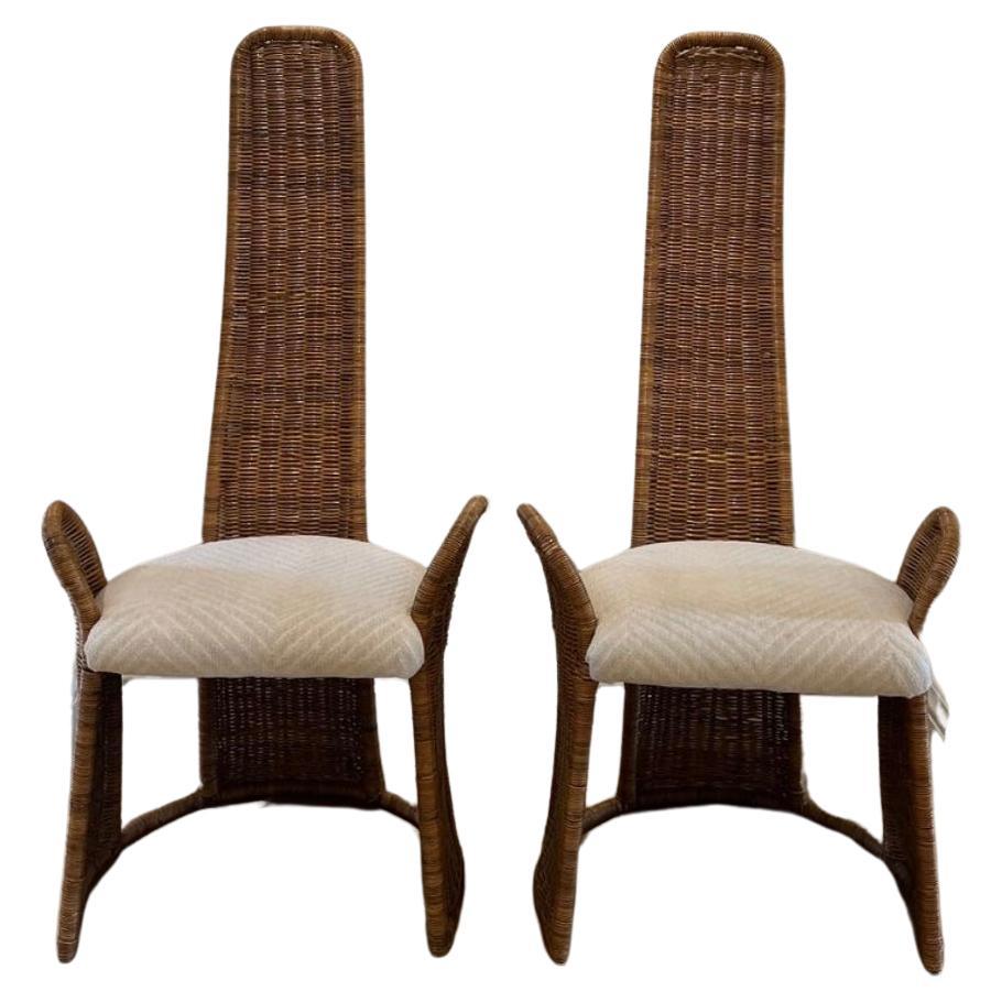 Pair of high back wicker accent chairs designed by Danny Ho Fong for Tropic-Cal For Sale