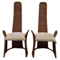 Vintage Pair of high back wicker accent chairs designed by Danny Ho Fong for Tropic-Cal