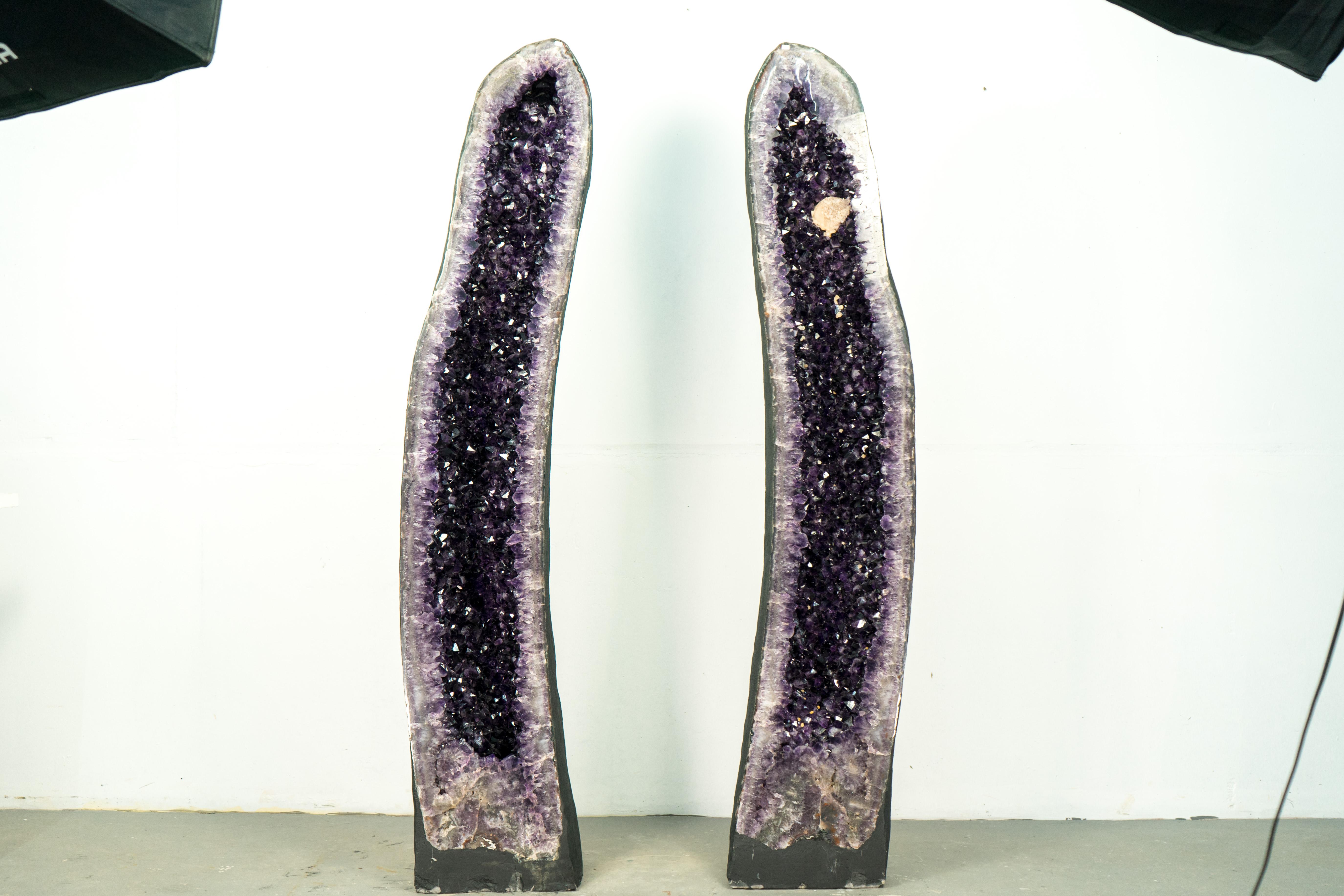 Bookmatching Pair of Big, X-Large Amethyst Geodes Featuring High-Grade Deep Purple Amethyst Druzy and an Intact Calcite

▫️ Description

These Giant Cathedral Amethyst Geodes, rare earth treasures, effortlessly transform any space into a luxurious