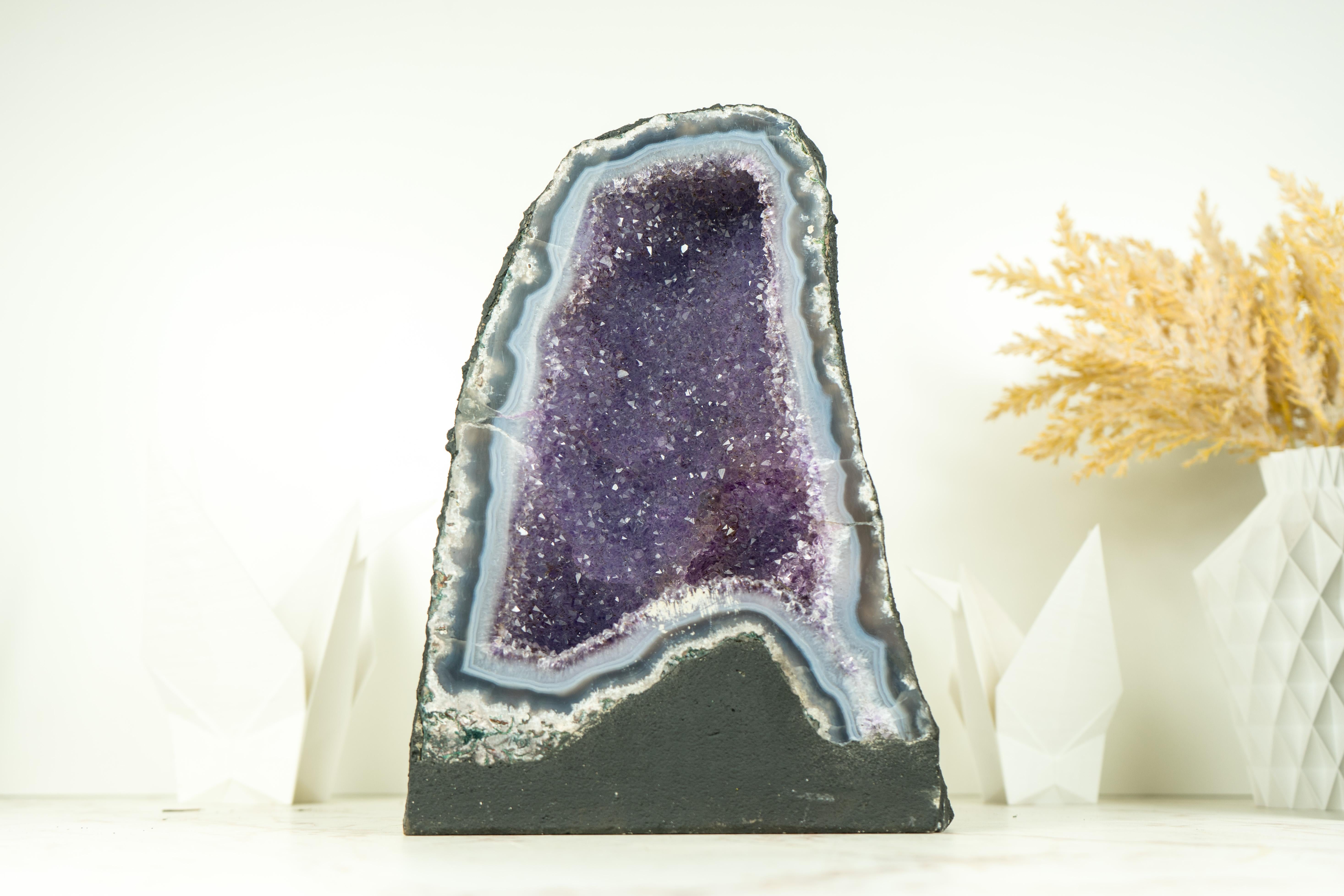 Small in size, these natural Agate Geodes bring many rare characteristics that turn them into natural artworks. Those characteristics, as the blue agate bands, the lavender galaxy druzy, and the perfection of their natural drawings will shine in