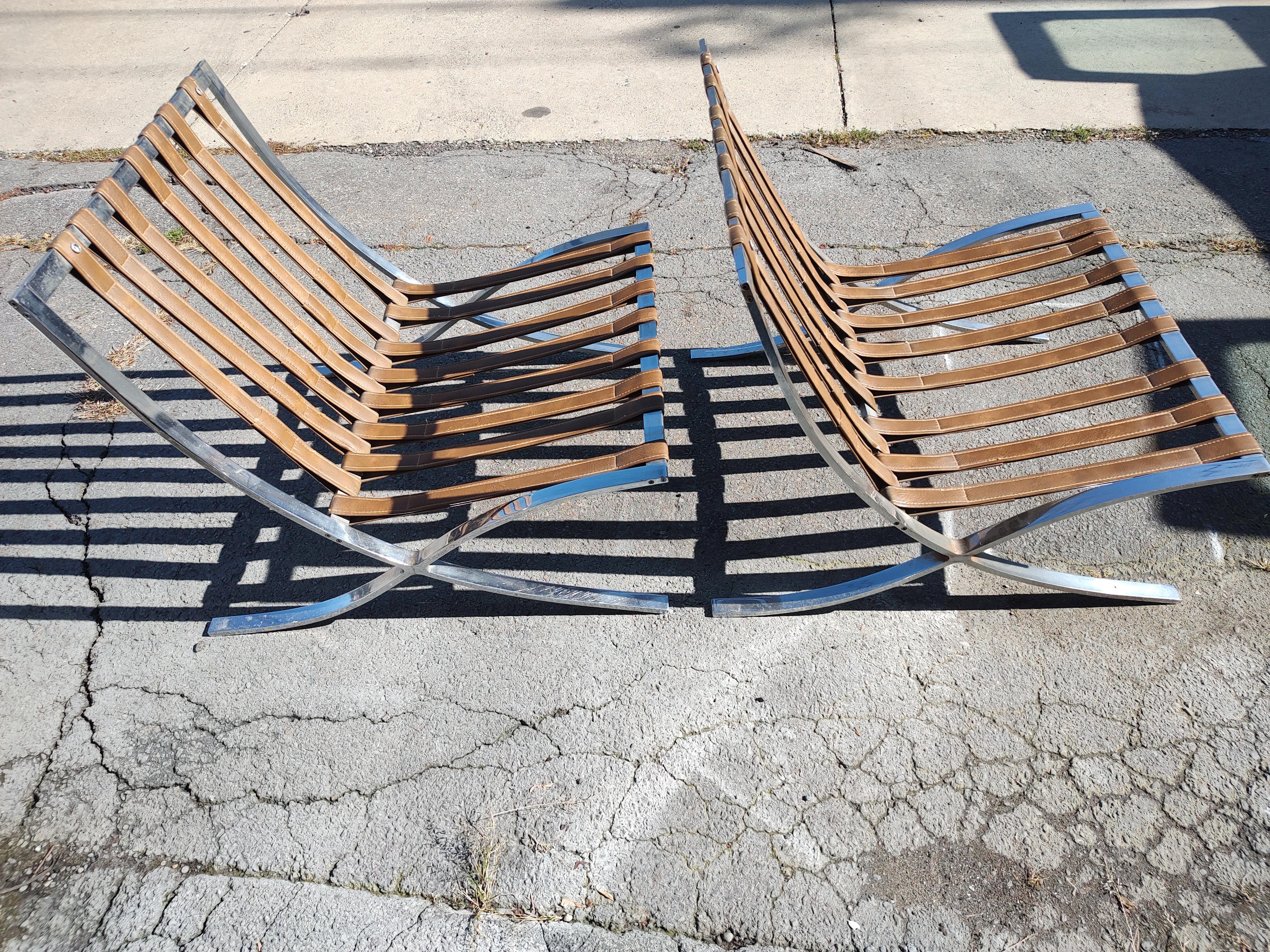 Cast Pair of High Quality Barcelona Lounge Chairs with Brown Naughahyde Vinyl Seats For Sale