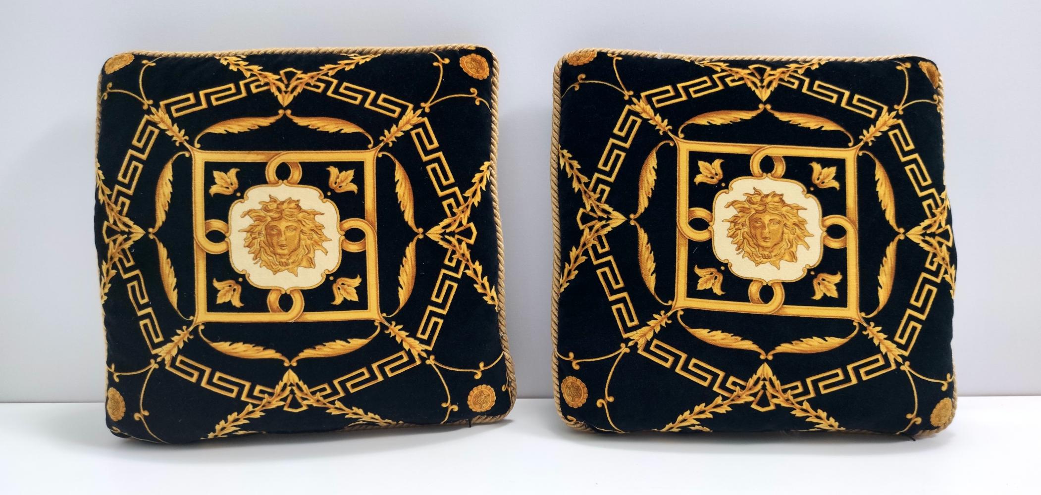 Made in Italy. 
These pillows features a high-quality velvet foam rubber upholstery, covered in fabric with a suggestive and elegant pattern on it by La Maison Versace. 
They might show slight traces of use since they are vintage, but they can be