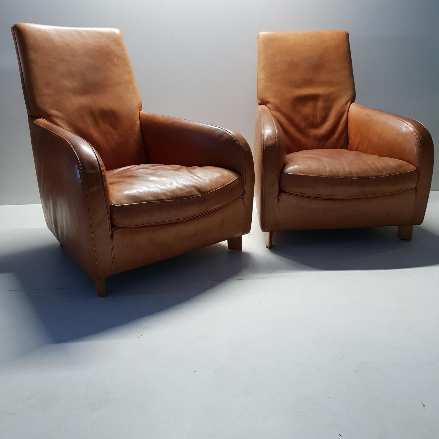 Pair of high quality cognac leather lounge chairs by Molinari (marked), 1990s.
Very thick leather with a nice patina.