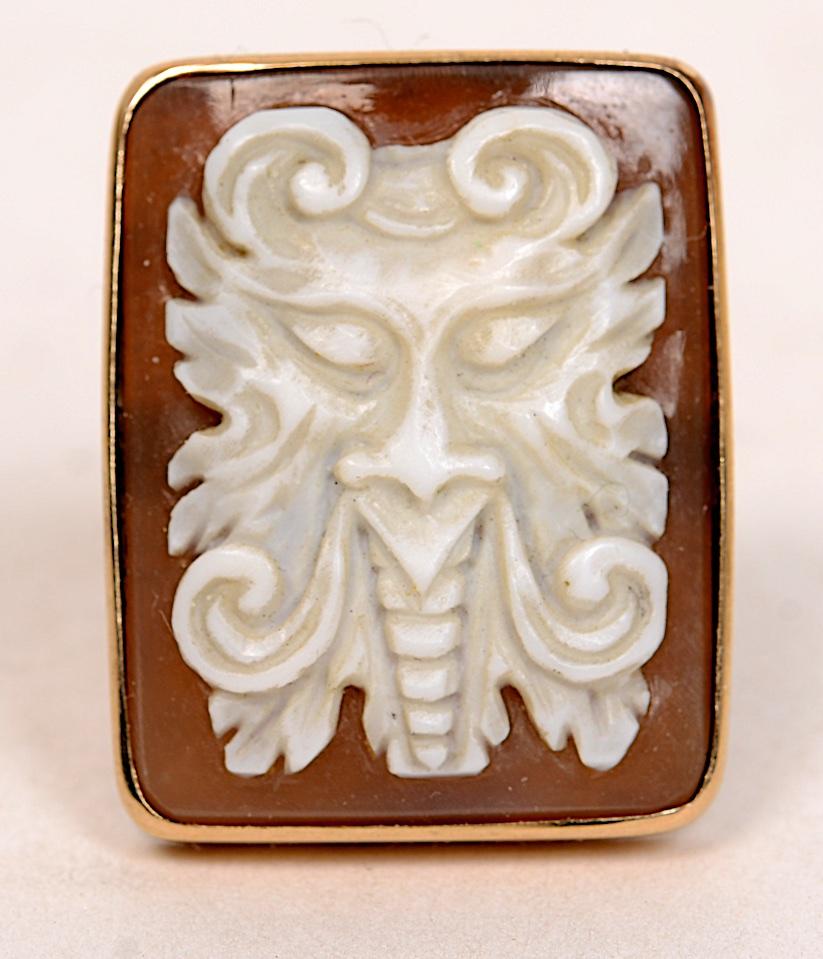 Pair of High Relief Carved Sardonyx Shell Cameo Cufflinks. The faces are of horned Satans or Devils. The frames are tested 14K yellow gold.