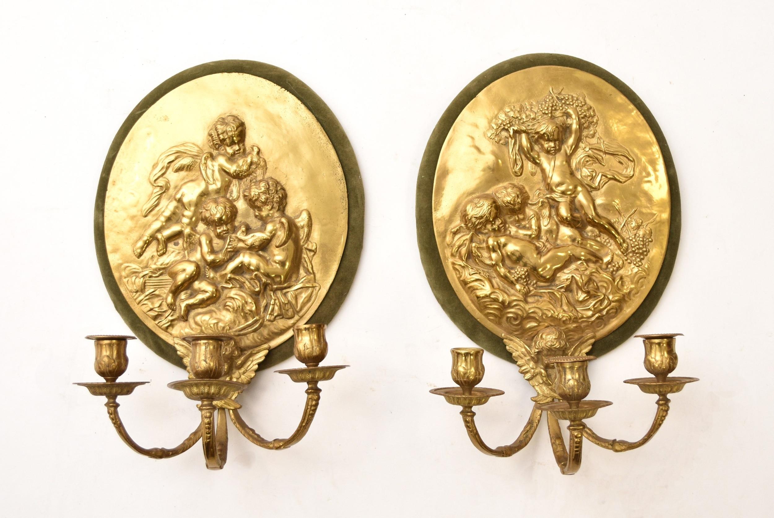 Pair of High Relief Cast Brass Playful Putti Wall Light Sconces 
Good condition, as seen.
From an important private collection.

Free international shipping.