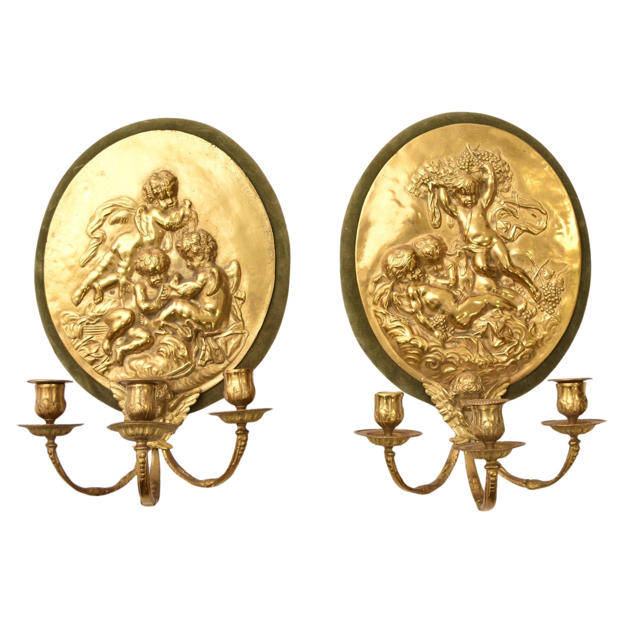 Pair of High Relief Cast Brass Playful Putti Wall Light Sconces For Sale
