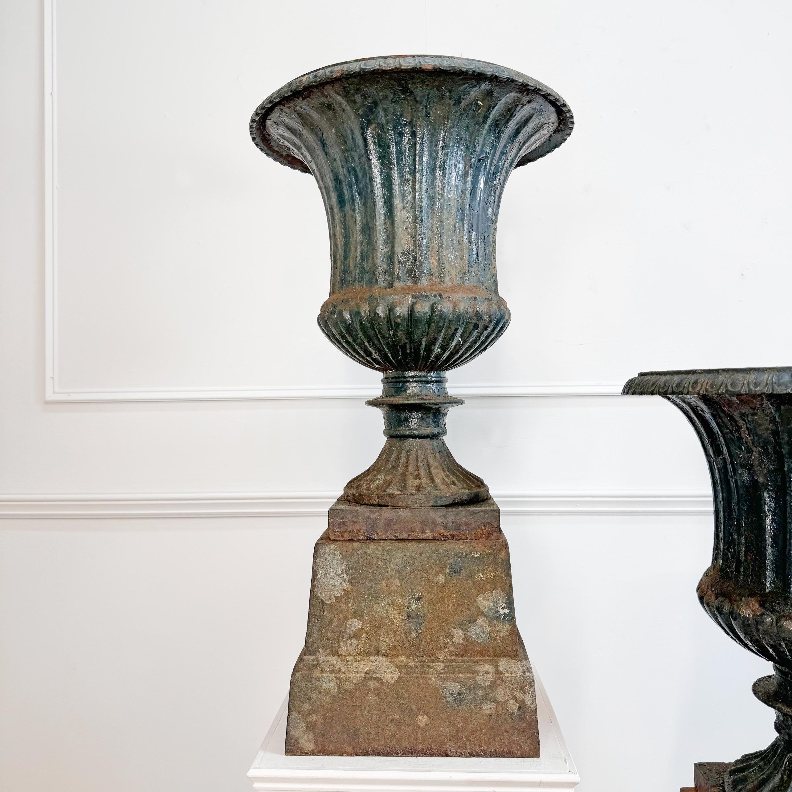 English Pair of High Victorian Cast Iron Campana Urns on Plinths For Sale