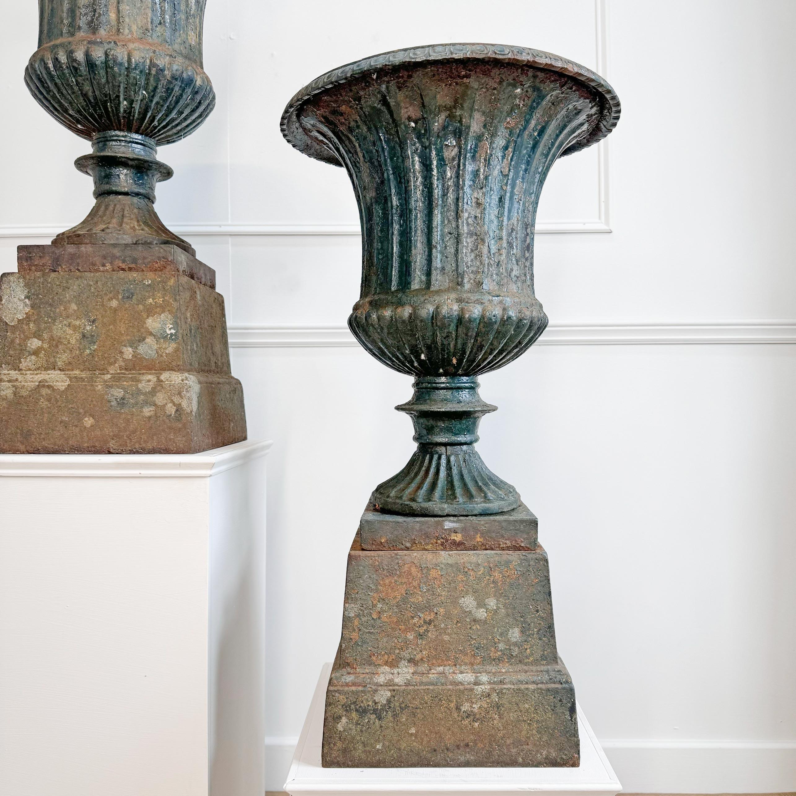 Late 19th Century Pair of High Victorian Cast Iron Campana Urns on Plinths For Sale