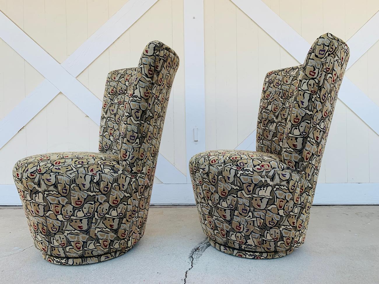 Pair of highback swivel chairs designed and manufactured in the US by Carter Furniture.

The chairs were custom made for James Wilson and custom upholstered, the name of the fabric pattern is Hot Lips Cherry.

The chairs are in very good