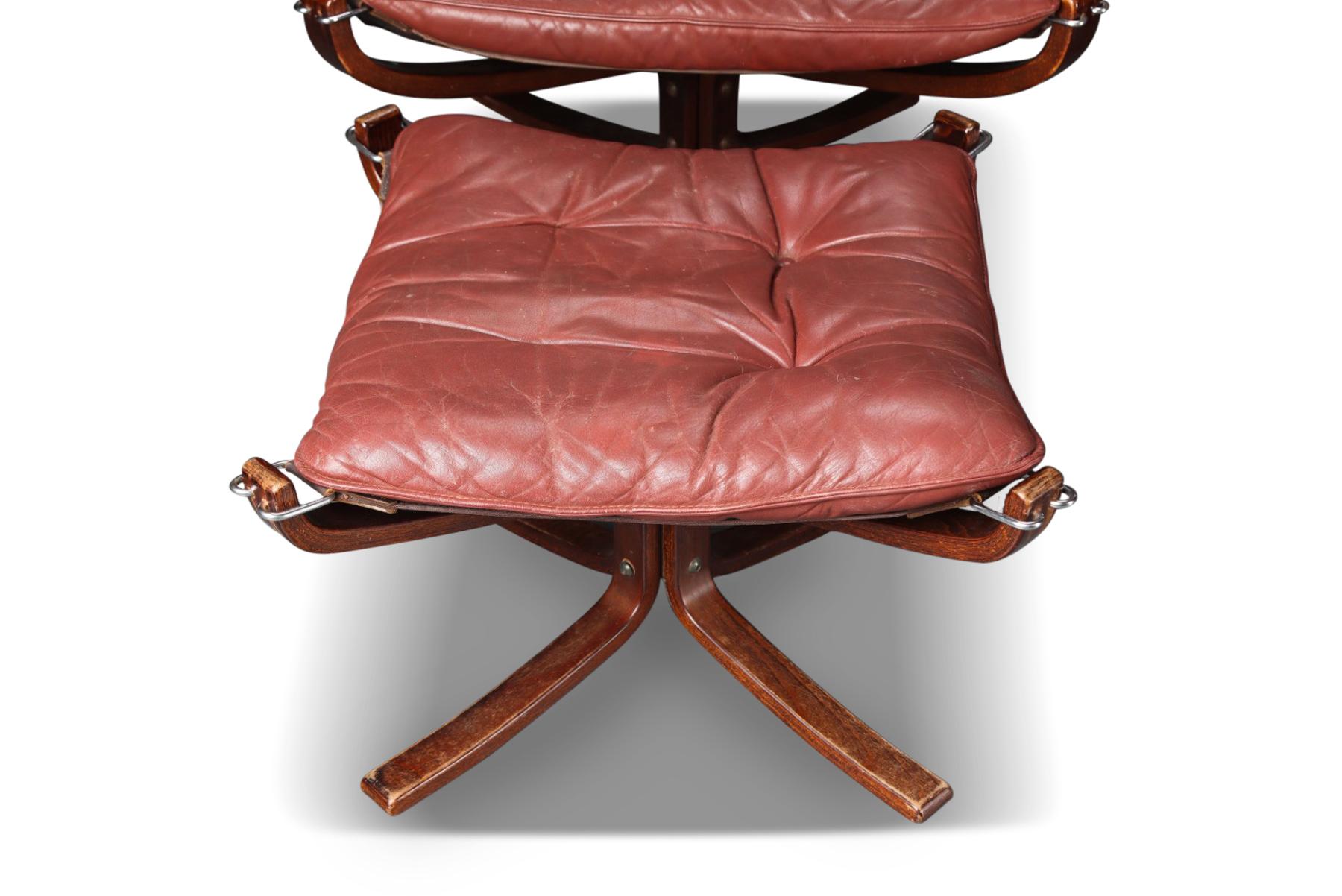20th Century Pair of Highback Winged Falcon Chairs with Ottomans in Rust Leather
