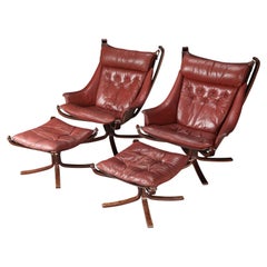 Pair of Highback Winged Falcon Chairs with Ottomans in Rust Leather