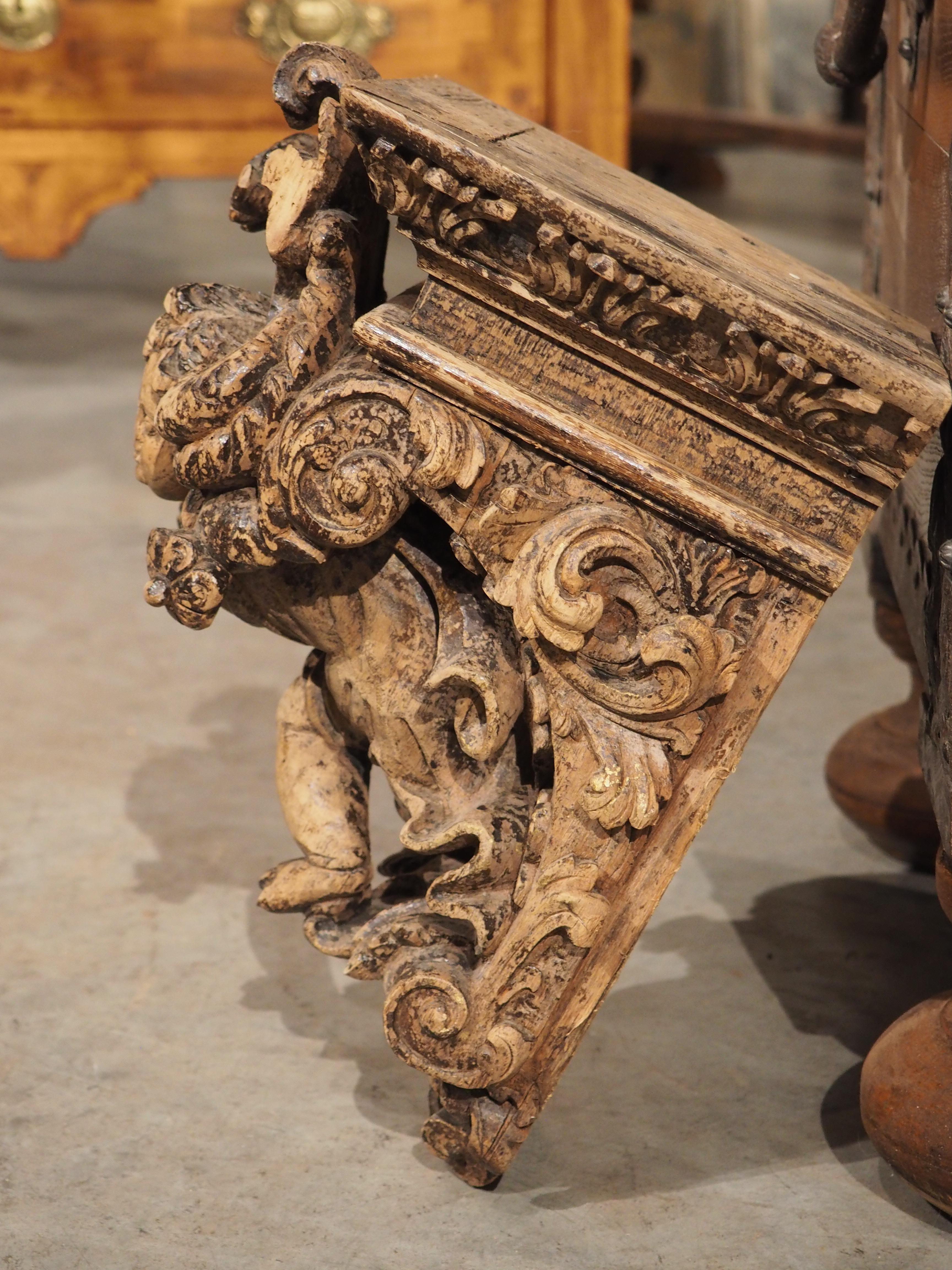 This pair of oak cherub brackets, or “consoles murale” originate from France and date to the mid-19th century. The intricate carvings adorning these marvels attest to the remarkable craftsmanship of their maker. Each corbel is fronted by an
