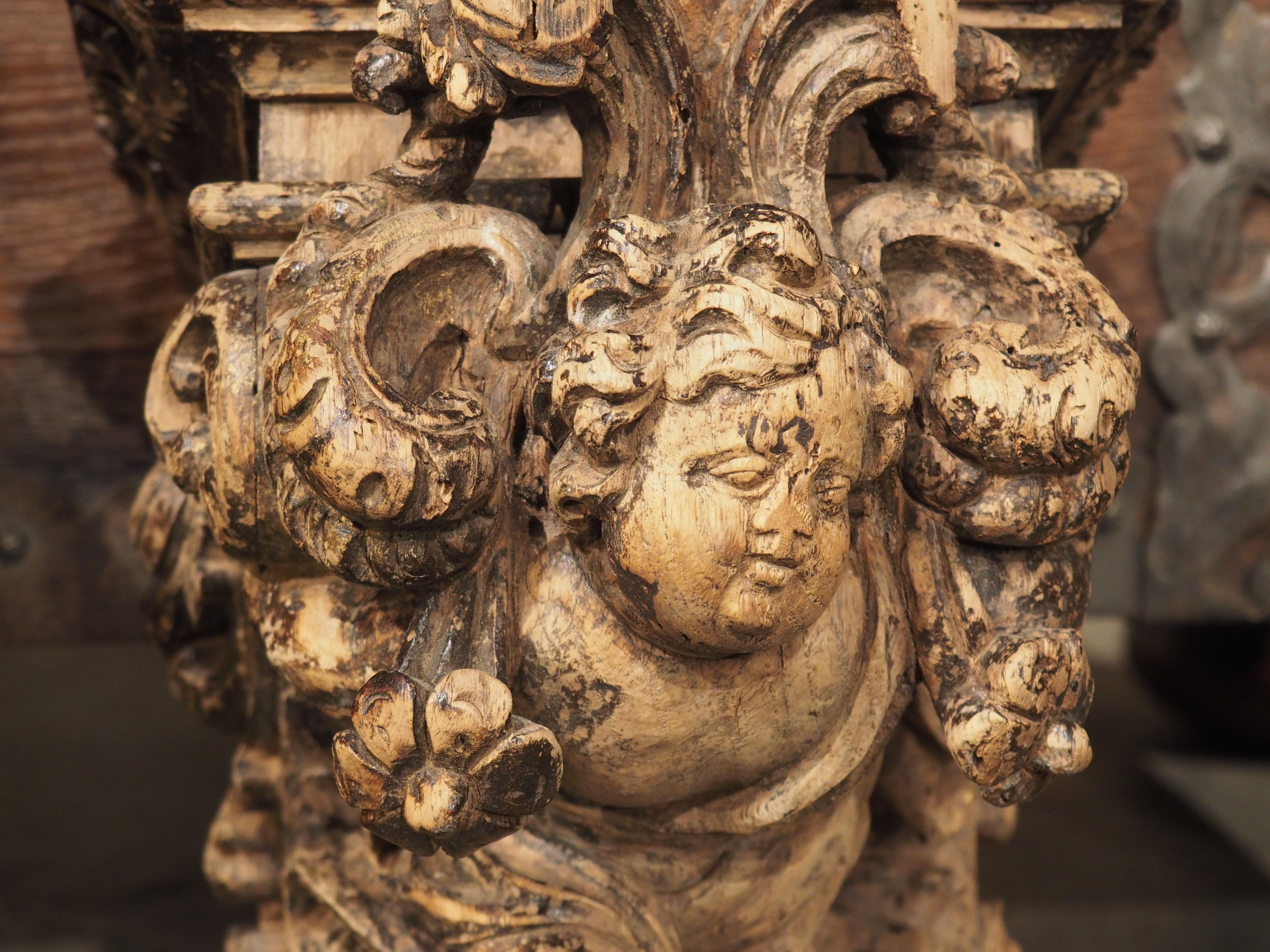 Bleached Pair of Highly Carved Partially Stripped French Oak Cherub Brackets, C. 1850 For Sale