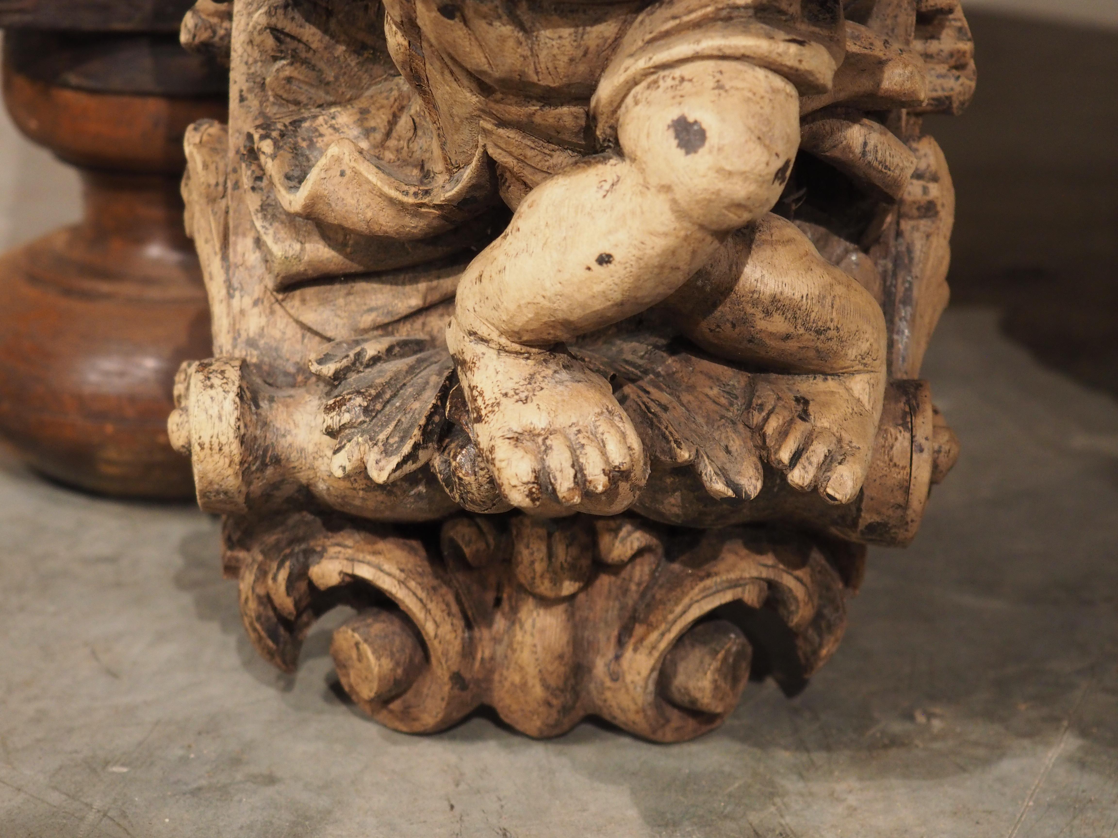 Mid-19th Century Pair of Highly Carved Partially Stripped French Oak Cherub Brackets, C. 1850 For Sale
