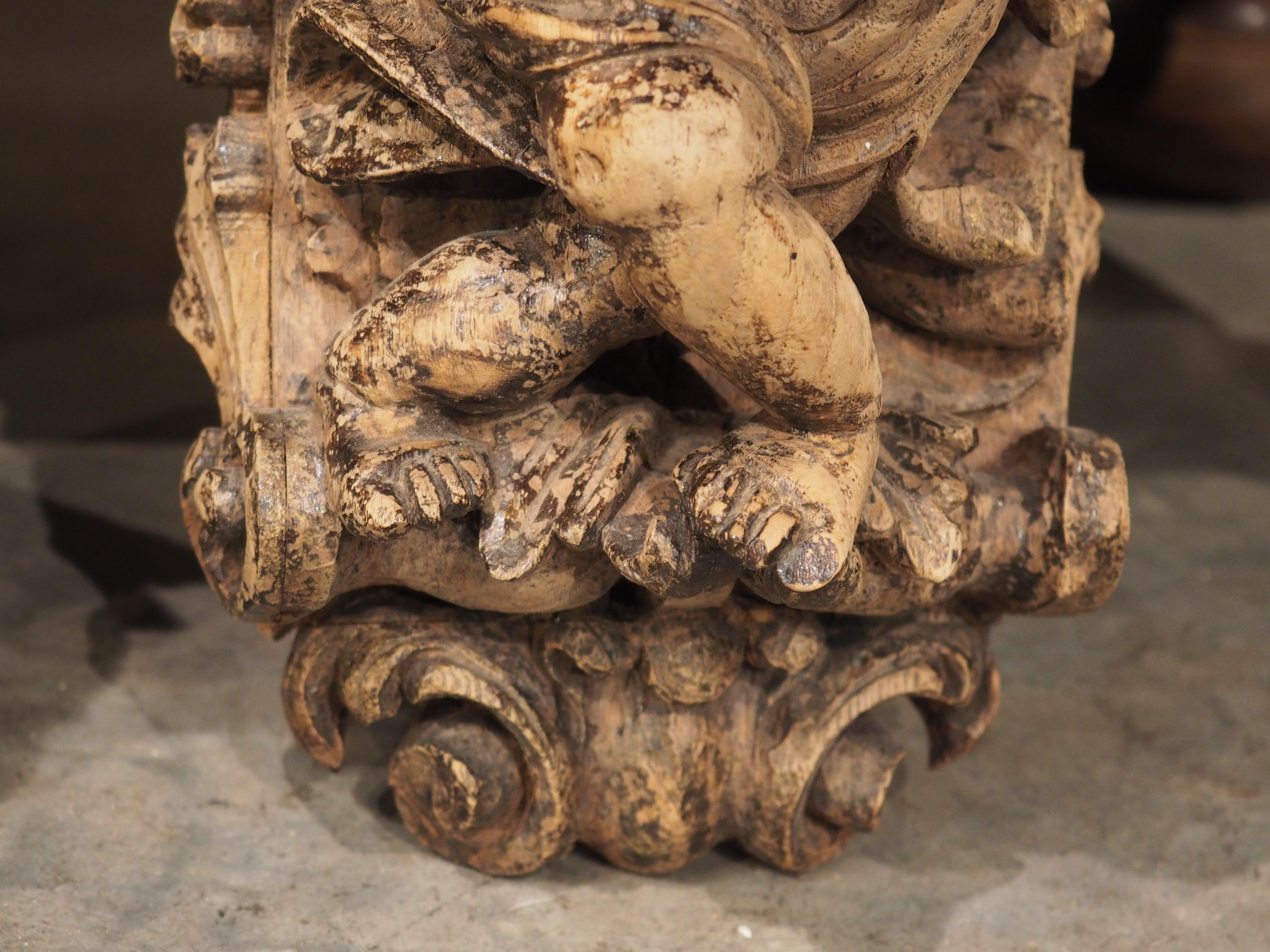 Wood Pair of Highly Carved Partially Stripped French Oak Cherub Brackets, C. 1850 For Sale
