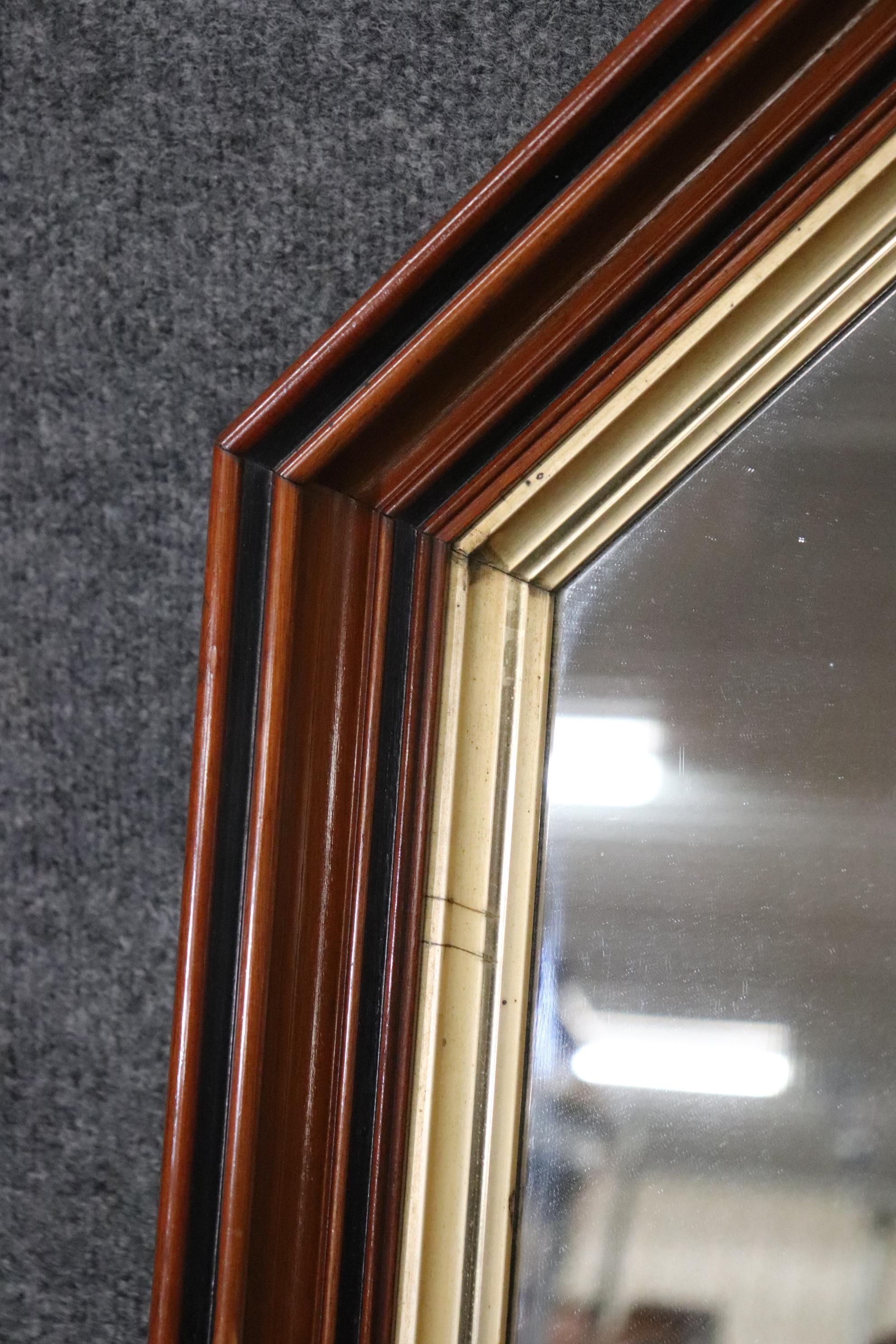 Pair of Highly Molded Walnut Geometric Pseudo Gothic Style Gilded Wall Mirrors  In Good Condition For Sale In Swedesboro, NJ