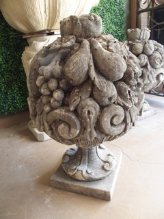 Pair of Highly Sculpted and Weathered Limestone Fruit Bouquets from Italy